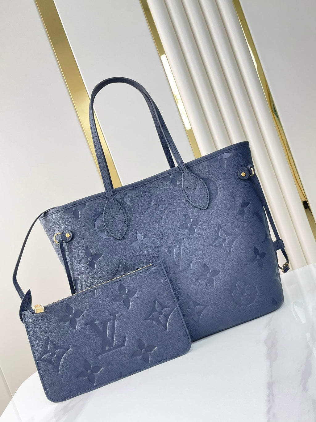 LOUIS VUITTON NEVERFULL MM 31 IN DARK NAVY MONOGRAM EMPREINTE LEATHER