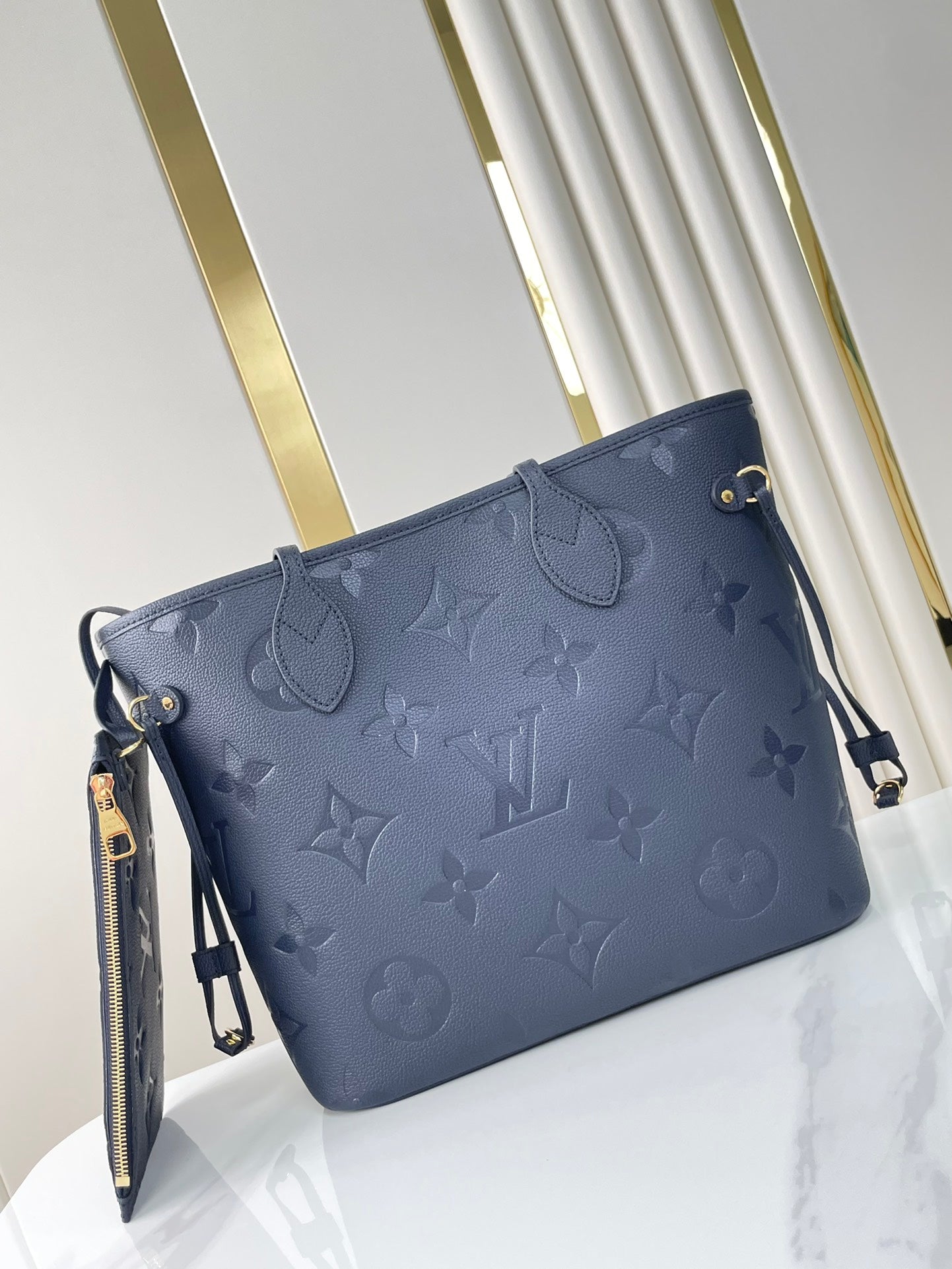 LOUIS VUITTON NEVERFULL MM 31 IN DARK NAVY MONOGRAM EMPREINTE LEATHER