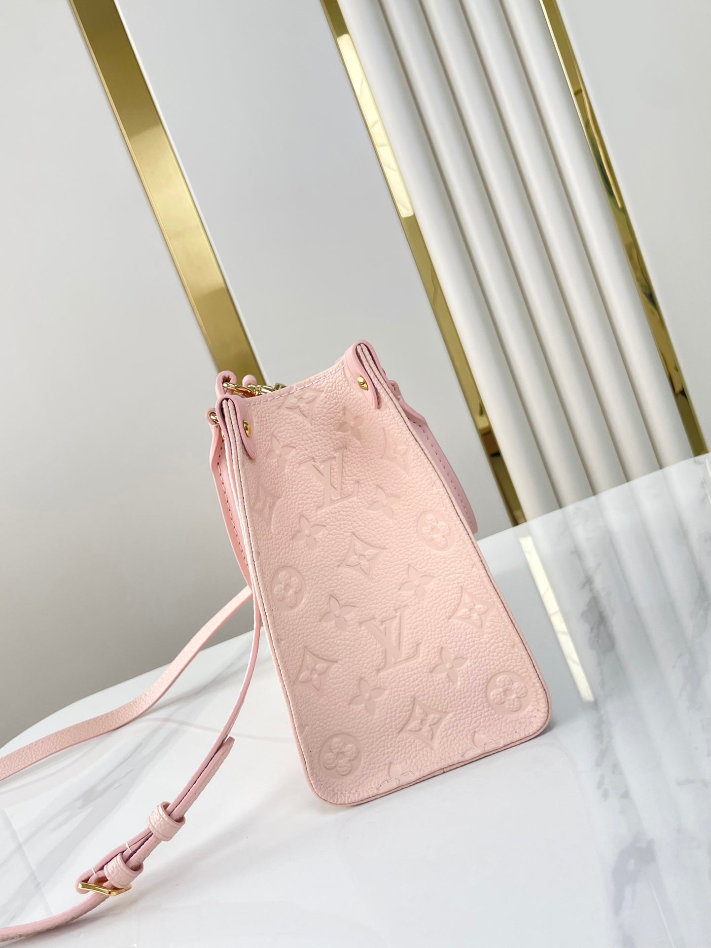 LOUIS VUITTON ONTHEGO PM 25 IN OPALE PINK MONOGRAM EMPREINTE LEATHER