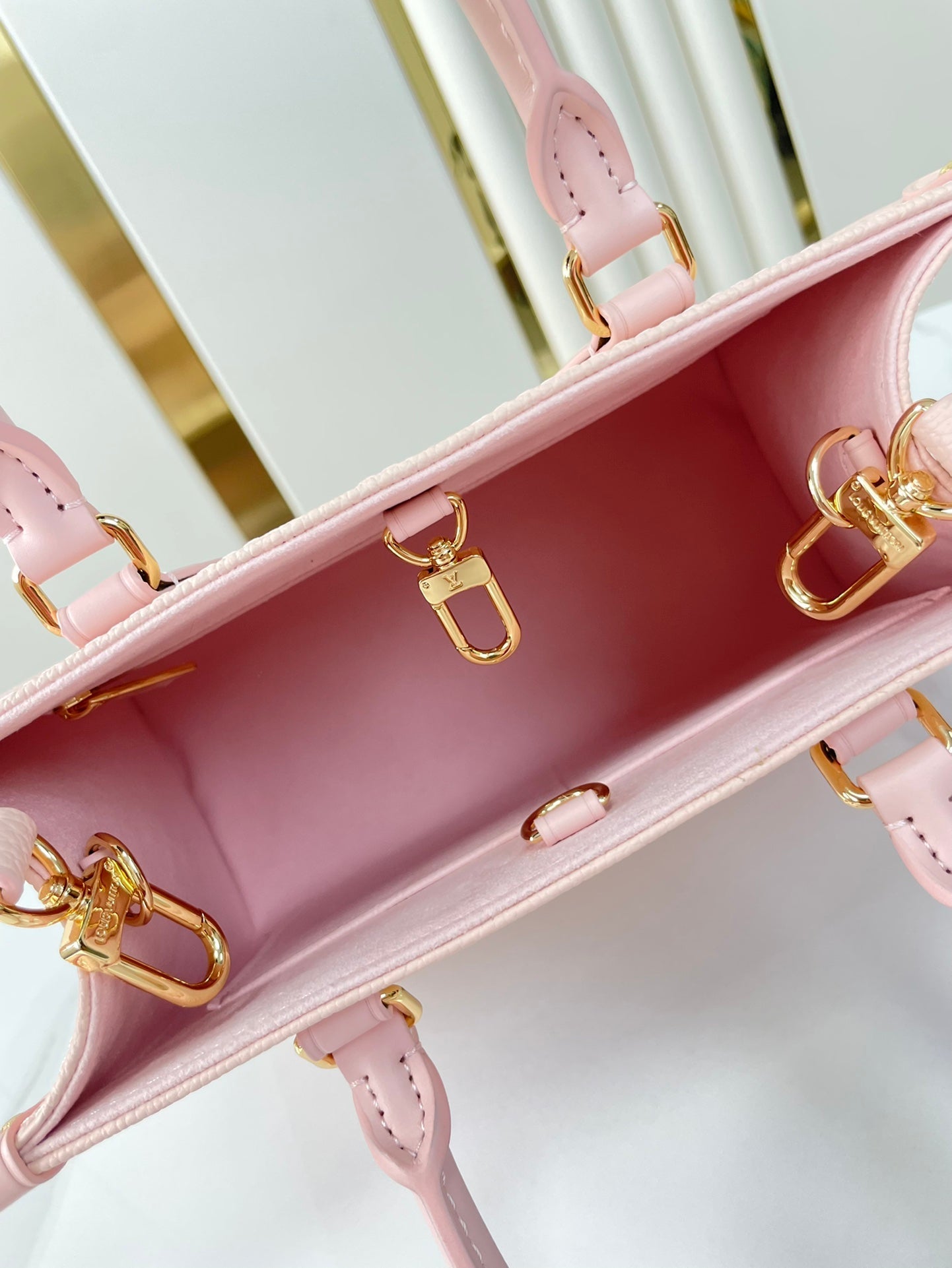 LOUIS VUITTON ONTHEGO PM 25 IN OPALE PINK MONOGRAM EMPREINTE LEATHER