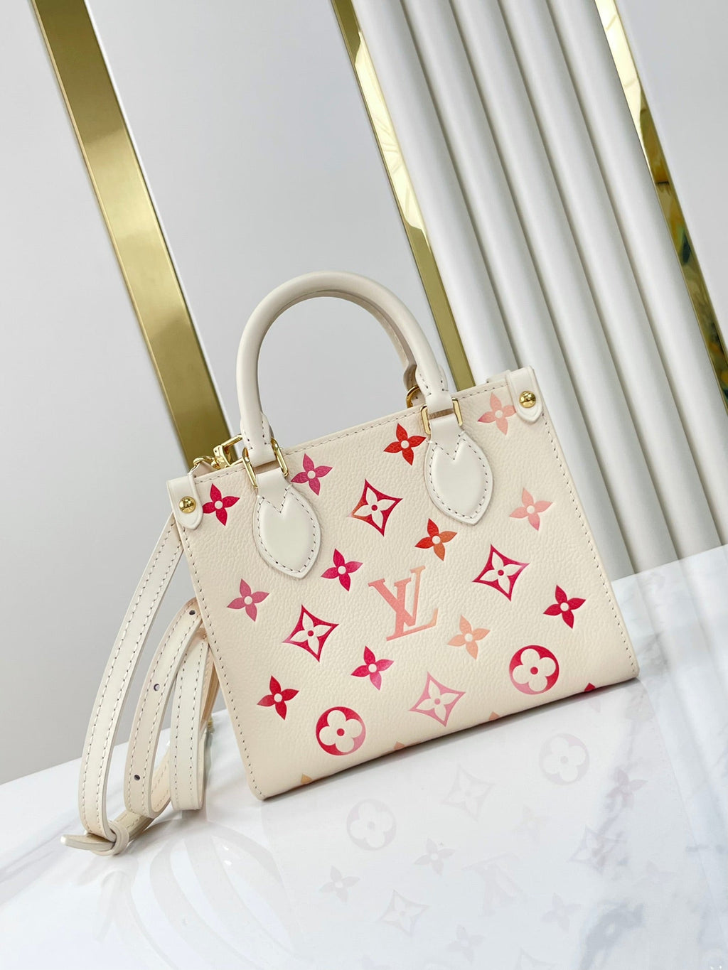 LOUIS VUITTON ONTHEGO BB 18 IN SUNRISE AQUARELLE MONOGRAM EMPREINTE LEATHER