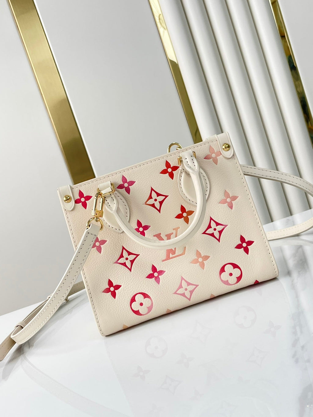 LOUIS VUITTON ONTHEGO BB 18 IN SUNRISE AQUARELLE MONOGRAM EMPREINTE LEATHER