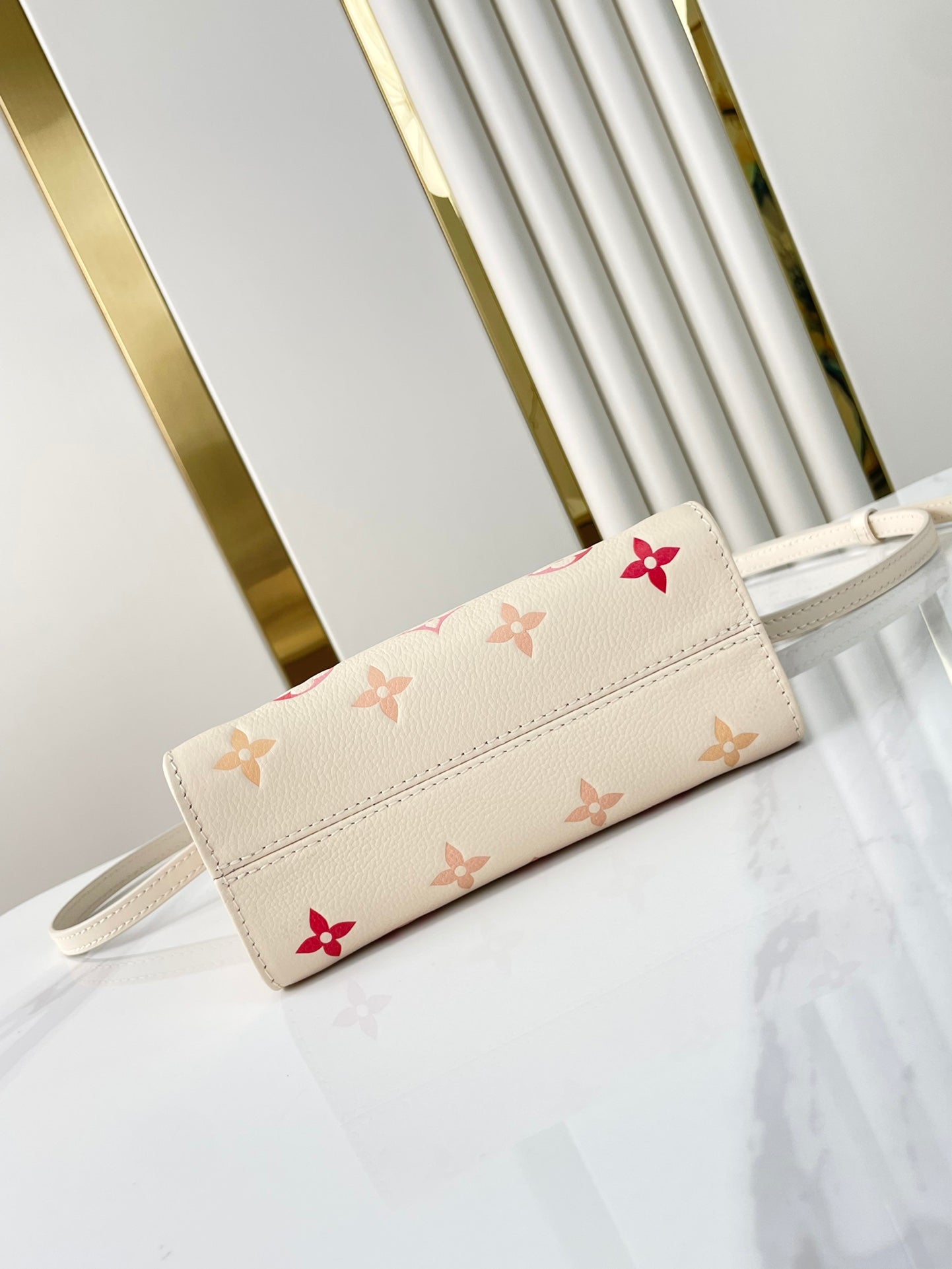 LOUIS VUITTON ONTHEGO BB 18 IN SUNRISE AQUARELLE MONOGRAM EMPREINTE LEATHER