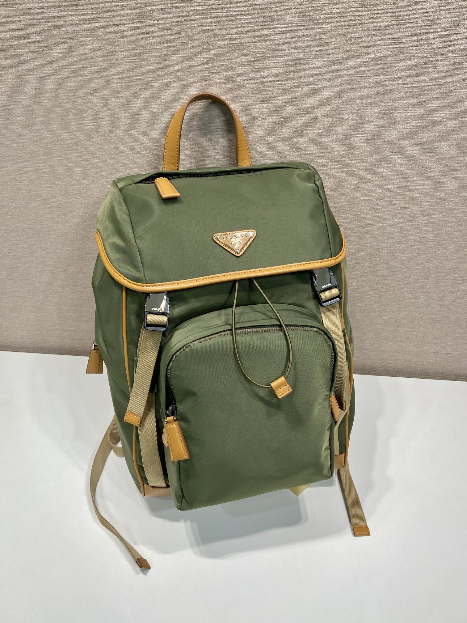 PRADA BACKPACK 45 IN SEAWEED GREEN RE-NYLON AND BROWN CALFSKIN TRIM