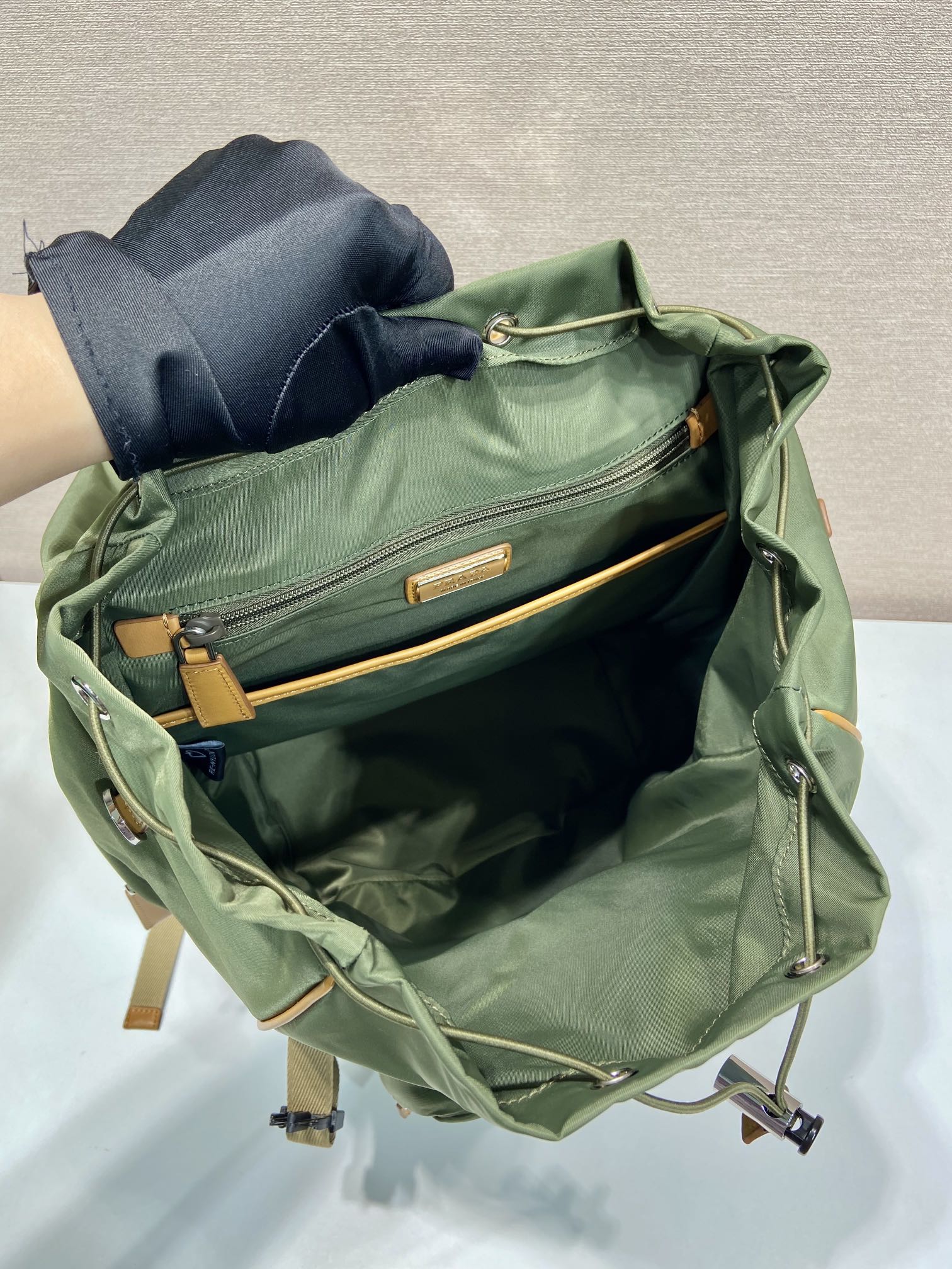 PRADA BACKPACK 45 IN SEAWEED GREEN RE-NYLON AND BROWN CALFSKIN TRIM