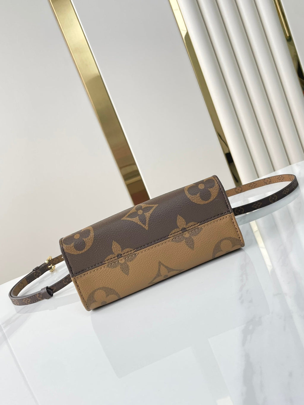 LOUIS VUITTON ONTHEGO BB 18 IN BROWN MONOGRAM AND MONOGRAM REVERSE CANVAS