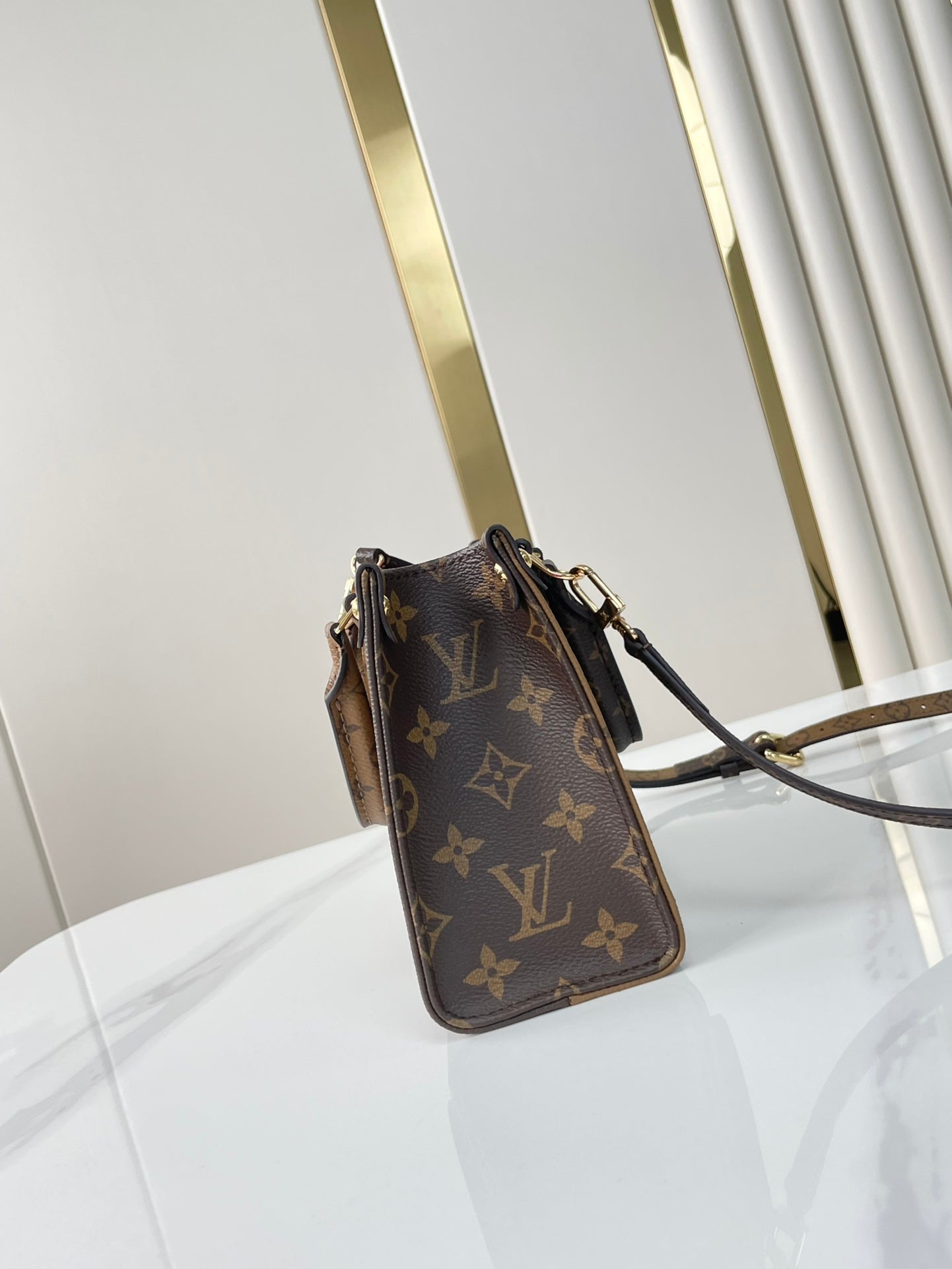 LOUIS VUITTON ONTHEGO BB 18 IN BROWN MONOGRAM AND MONOGRAM REVERSE CANVAS
