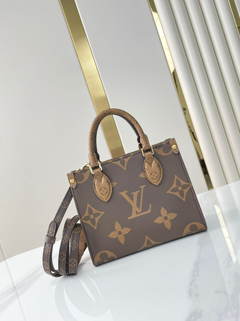 LOUIS VUITTON ONTHEGO BB 18 IN BROWN MONOGRAM AND MONOGRAM REVERSE CANVAS