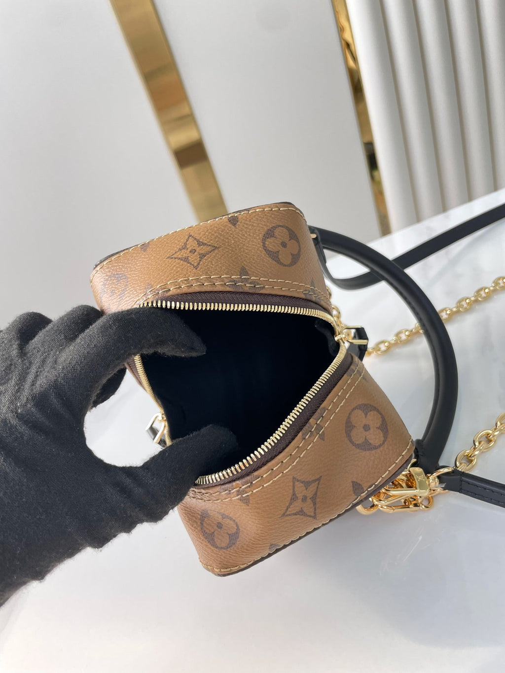 LOUIS VUITTON DICE 9 IN BROWN MONOGRAM AND MONOGRAM REVERSE CANVAS GOLD HARDWARE
