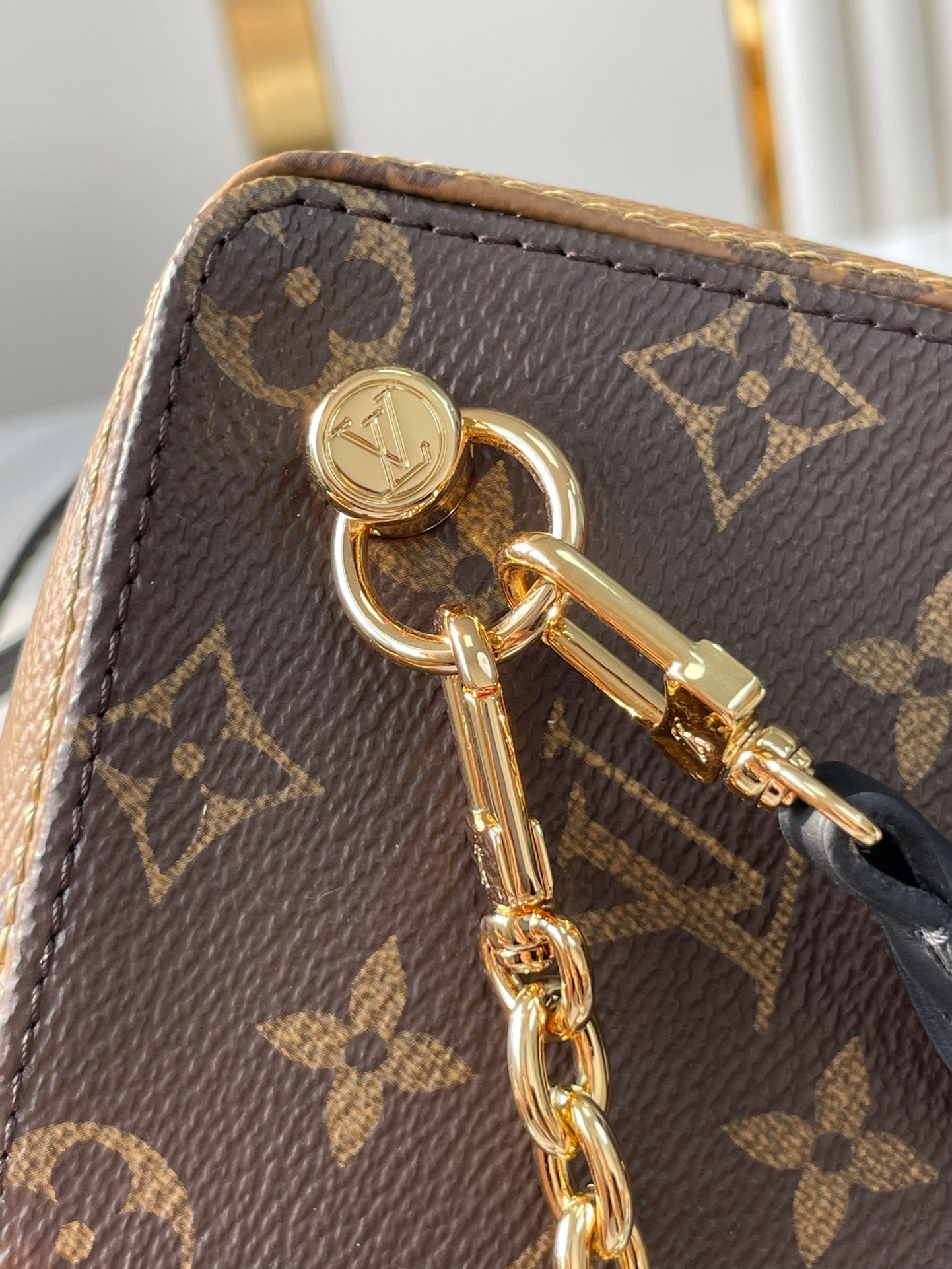 LOUIS VUITTON DICE 9 IN BROWN MONOGRAM AND MONOGRAM REVERSE CANVAS GOLD HARDWARE