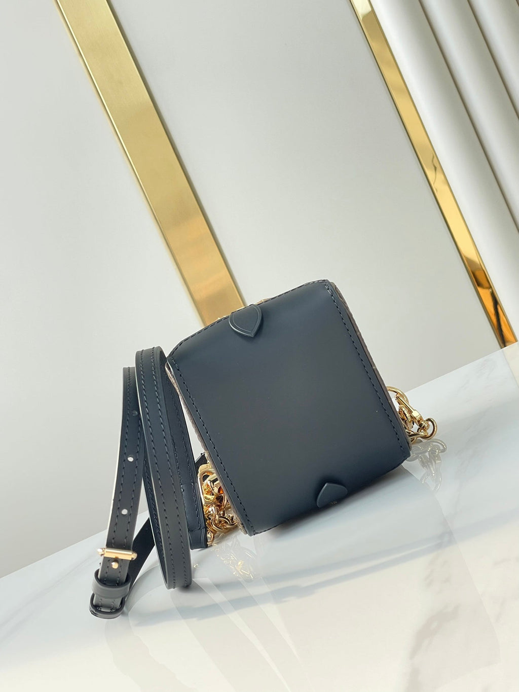 LOUIS VUITTON DICE 9 IN BROWN MONOGRAM AND MONOGRAM REVERSE CANVAS GOLD HARDWARE