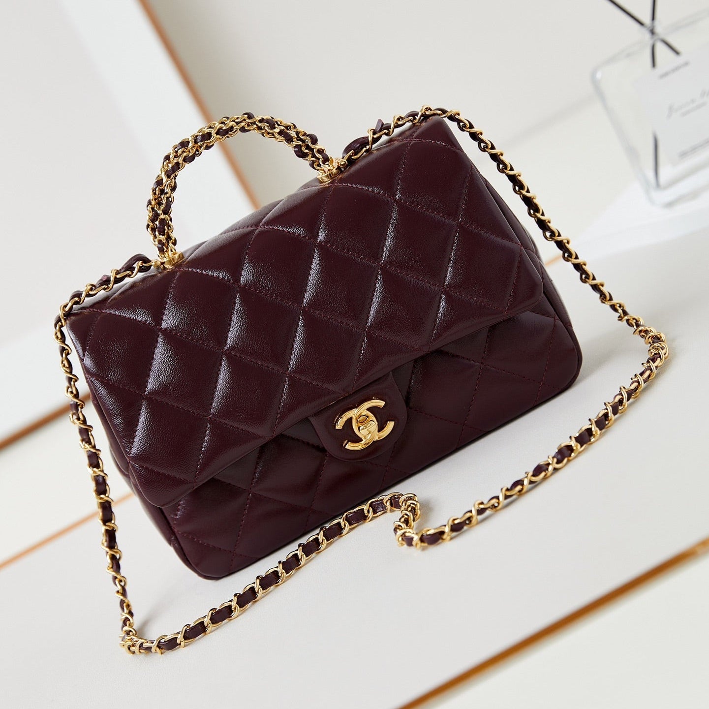 CHANEL FLAP BAG WITH TOP HANDLE 25 IN WINE RED OIL-WAX LAMBSKIN GOLD HARDWARE