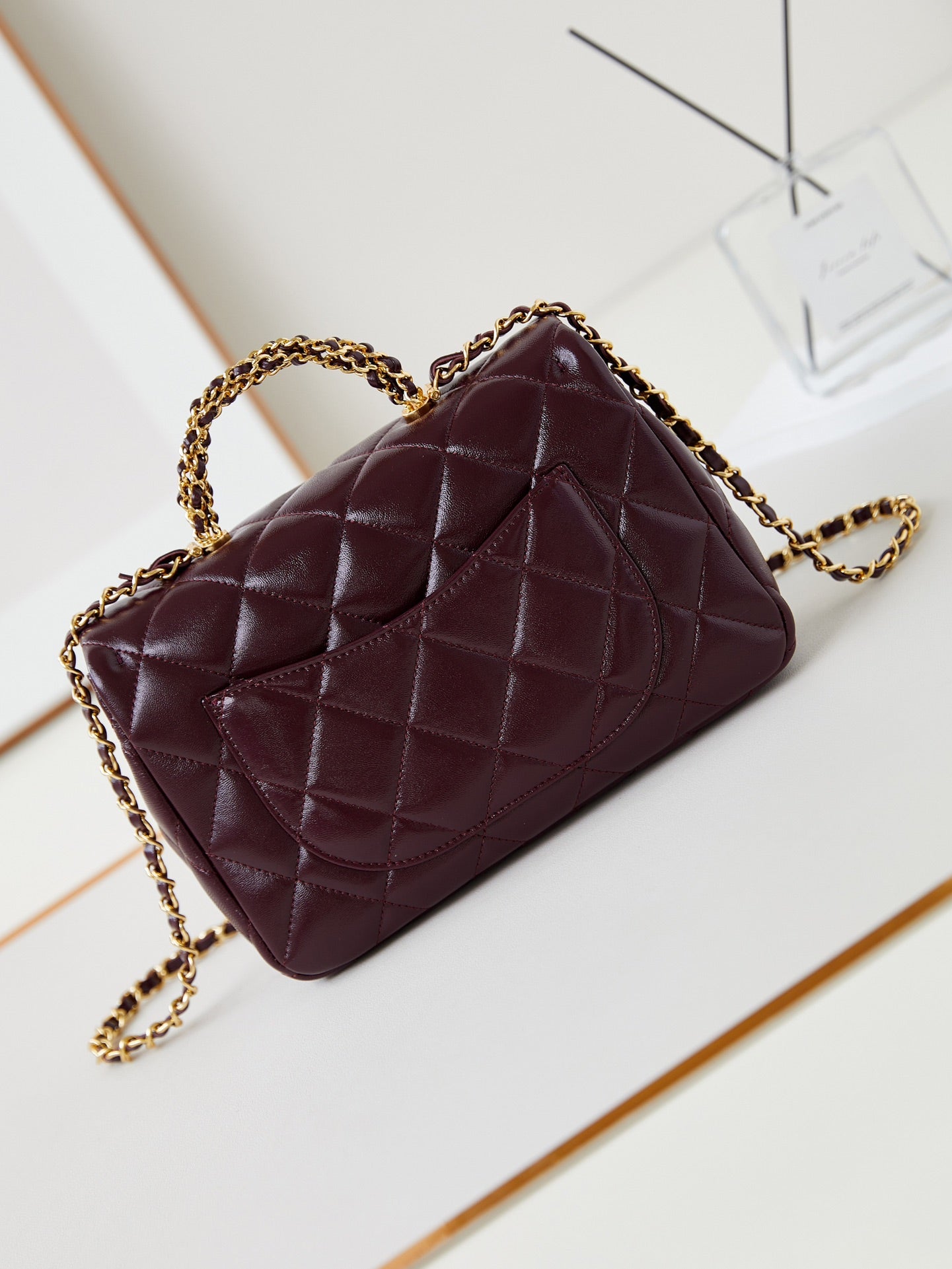 CHANEL FLAP BAG WITH TOP HANDLE 25 IN WINE RED OIL-WAX LAMBSKIN GOLD HARDWARE