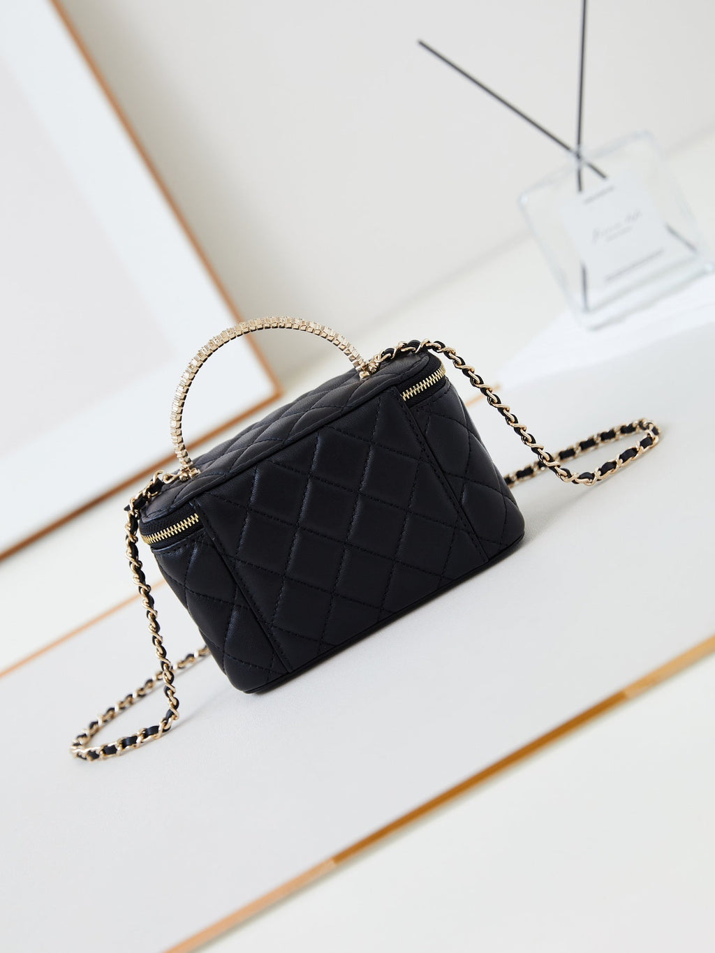CHANEL 25S MINI VANITY BAG 16 CM IN BLACK LAMBSKIN WITH CRYSTAL-EMBELLISHED  LOGO