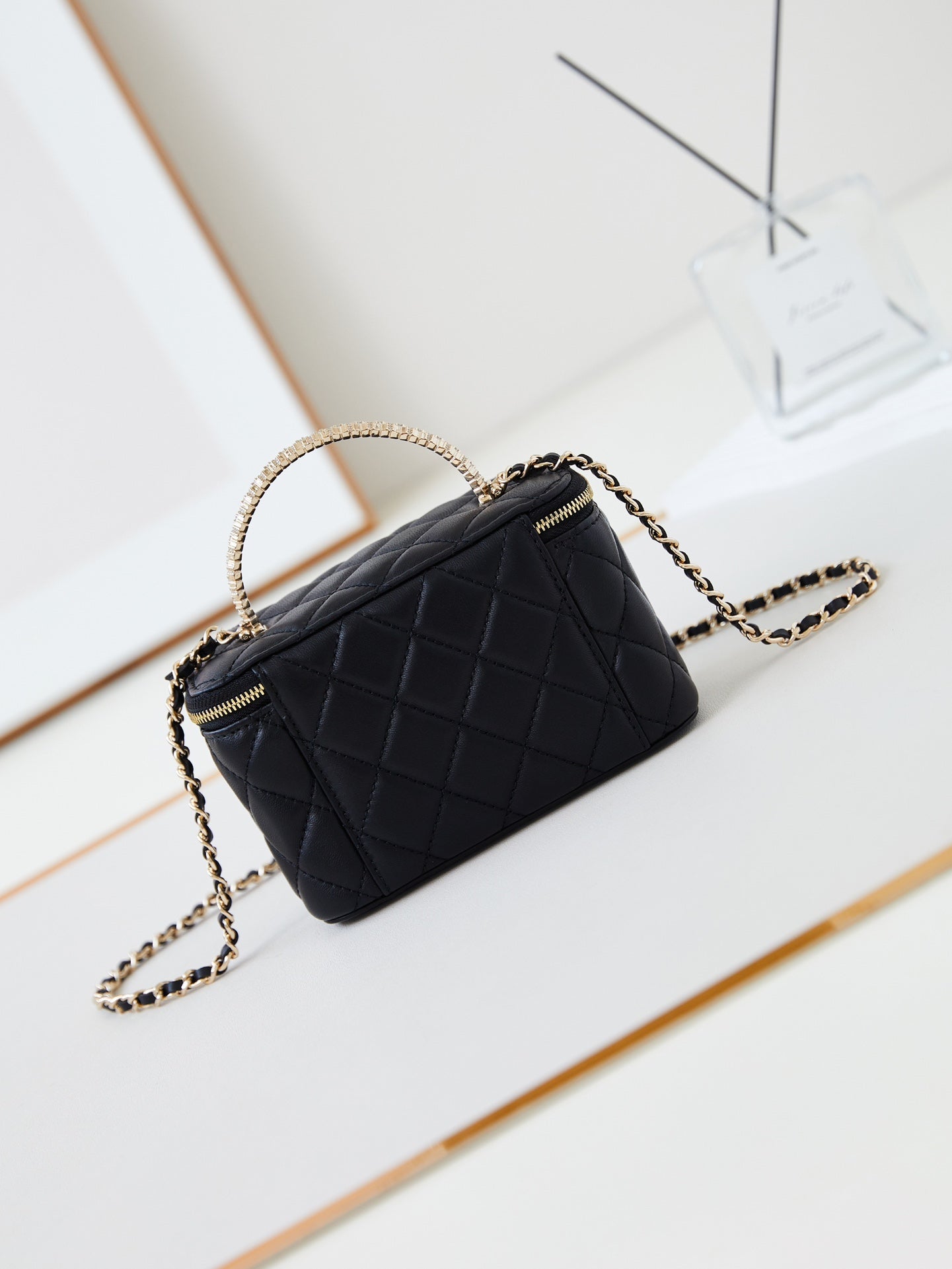CHANEL 25S MINI VANITY BAG 16 CM IN BLACK LAMBSKIN WITH CRYSTAL-EMBELLISHED  LOGO