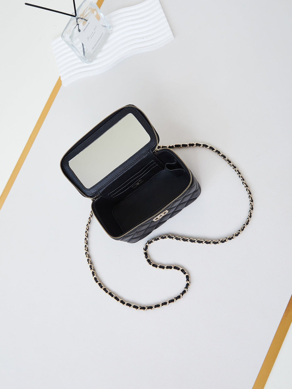 CHANEL 25S MINI VANITY BAG 16 CM IN BLACK LAMBSKIN WITH CRYSTAL-EMBELLISHED  LOGO