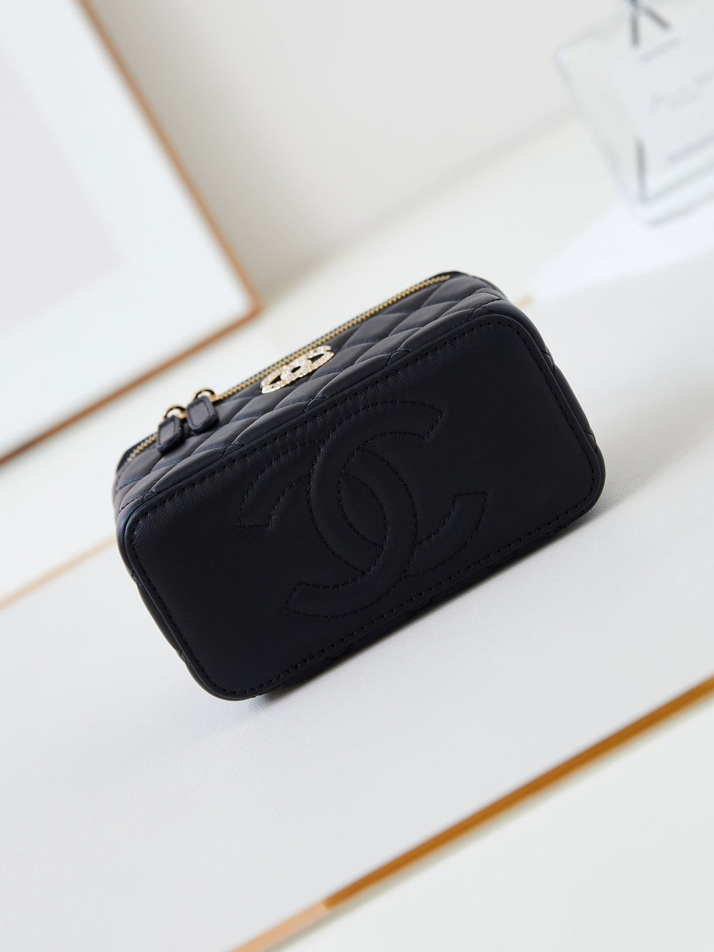CHANEL 25S MINI VANITY BAG 16 CM IN BLACK LAMBSKIN WITH CRYSTAL-EMBELLISHED  LOGO