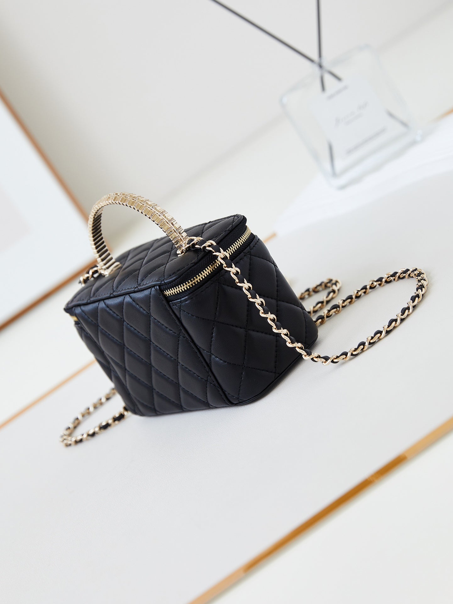 CHANEL 25S MINI VANITY BAG 16 CM IN BLACK LAMBSKIN WITH CRYSTAL-EMBELLISHED  LOGO