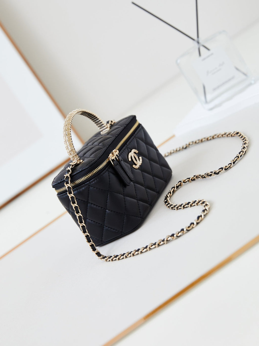 CHANEL 25S MINI VANITY BAG 16 CM IN BLACK LAMBSKIN WITH CRYSTAL-EMBELLISHED  LOGO