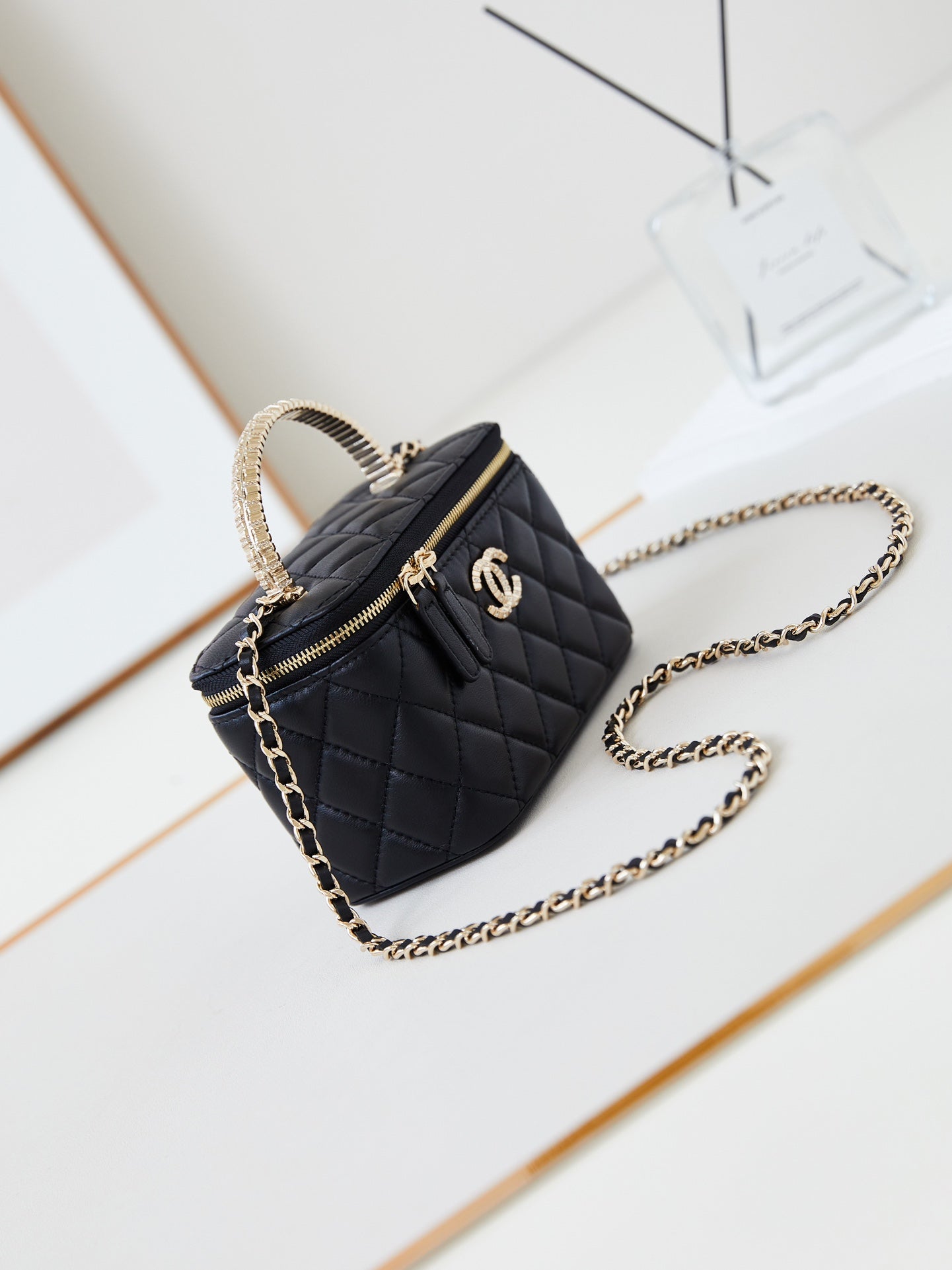 CHANEL 25S MINI VANITY BAG 16 CM IN BLACK LAMBSKIN WITH CRYSTAL-EMBELLISHED  LOGO