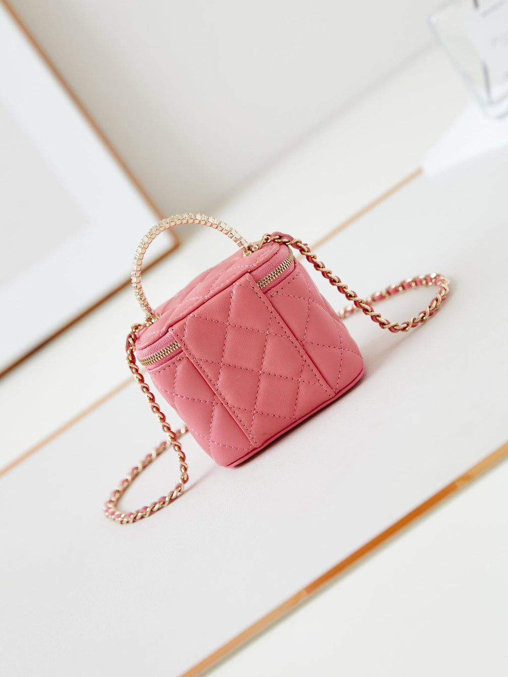 CHANEL 25S MINI VANITY BAG 11 CM IN PEACH PINK LAMBSKIN WITH CRYSTAL-EMBELLISHED  LOGO