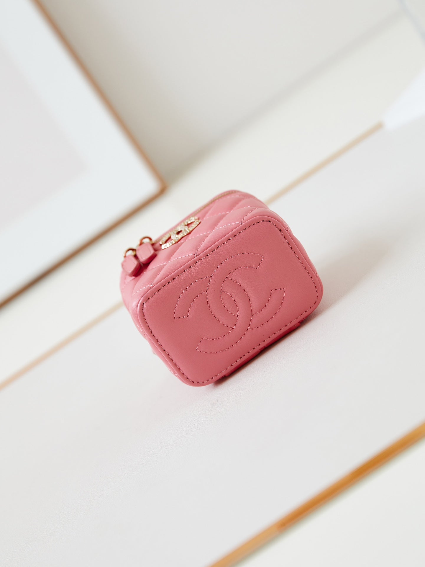 CHANEL 25S MINI VANITY BAG 11 CM IN PEACH PINK LAMBSKIN WITH CRYSTAL-EMBELLISHED  LOGO