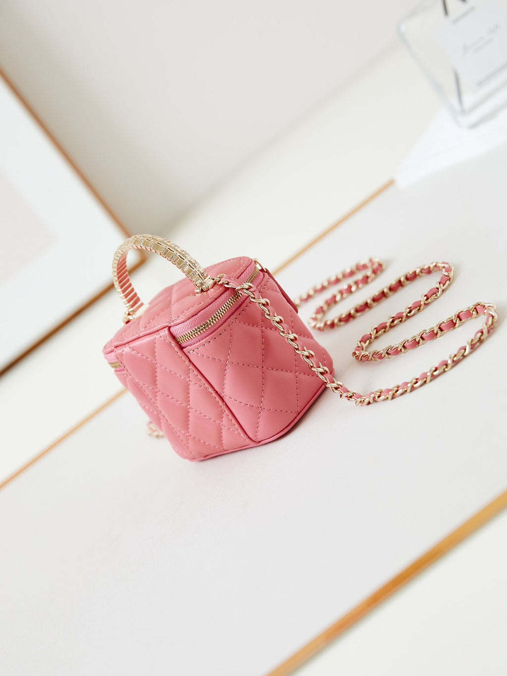 CHANEL 25S MINI VANITY BAG 11 CM IN PEACH PINK LAMBSKIN WITH CRYSTAL-EMBELLISHED  LOGO
