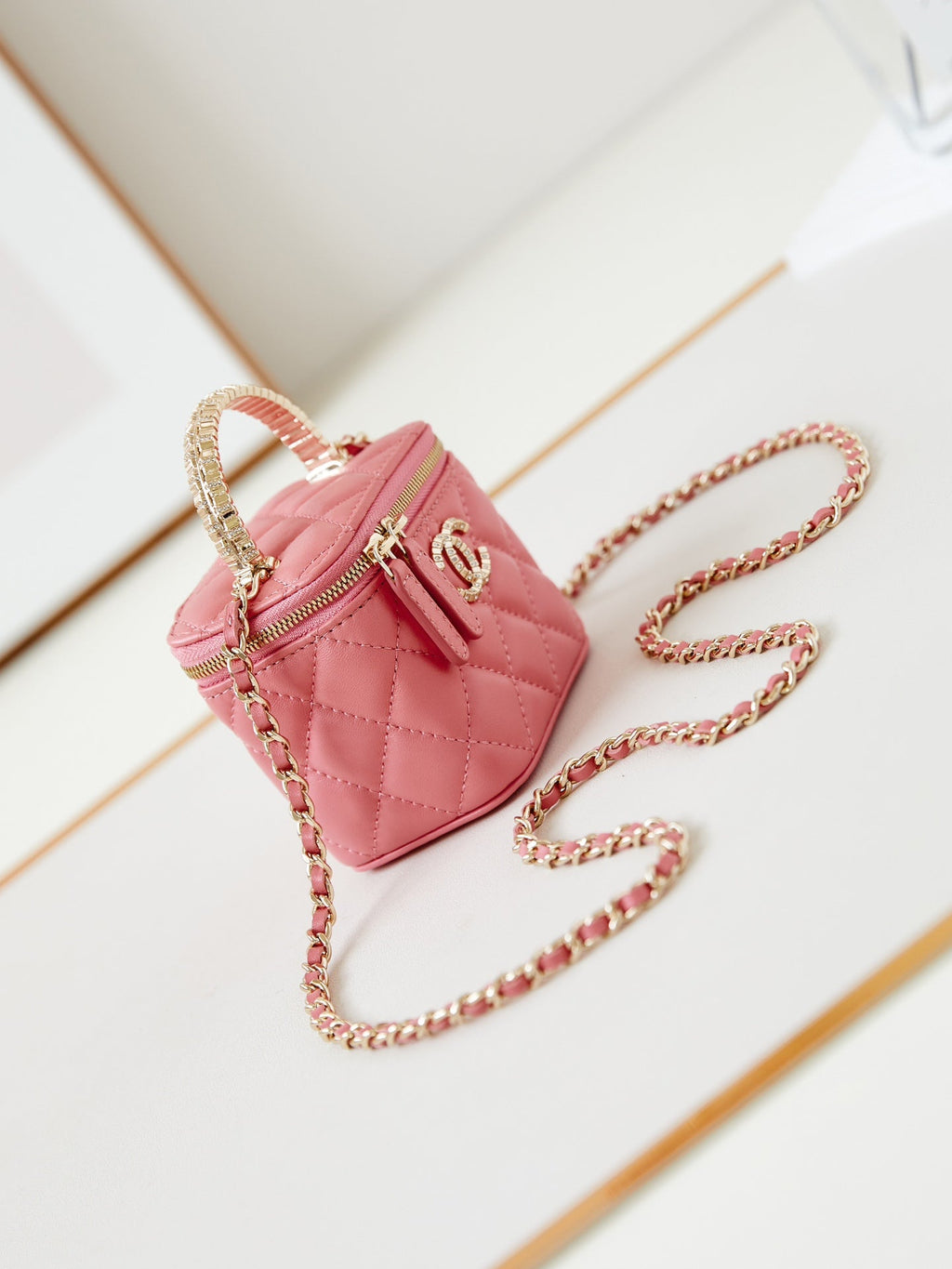 CHANEL 25S MINI VANITY BAG 11 CM IN PEACH PINK LAMBSKIN WITH CRYSTAL-EMBELLISHED  LOGO