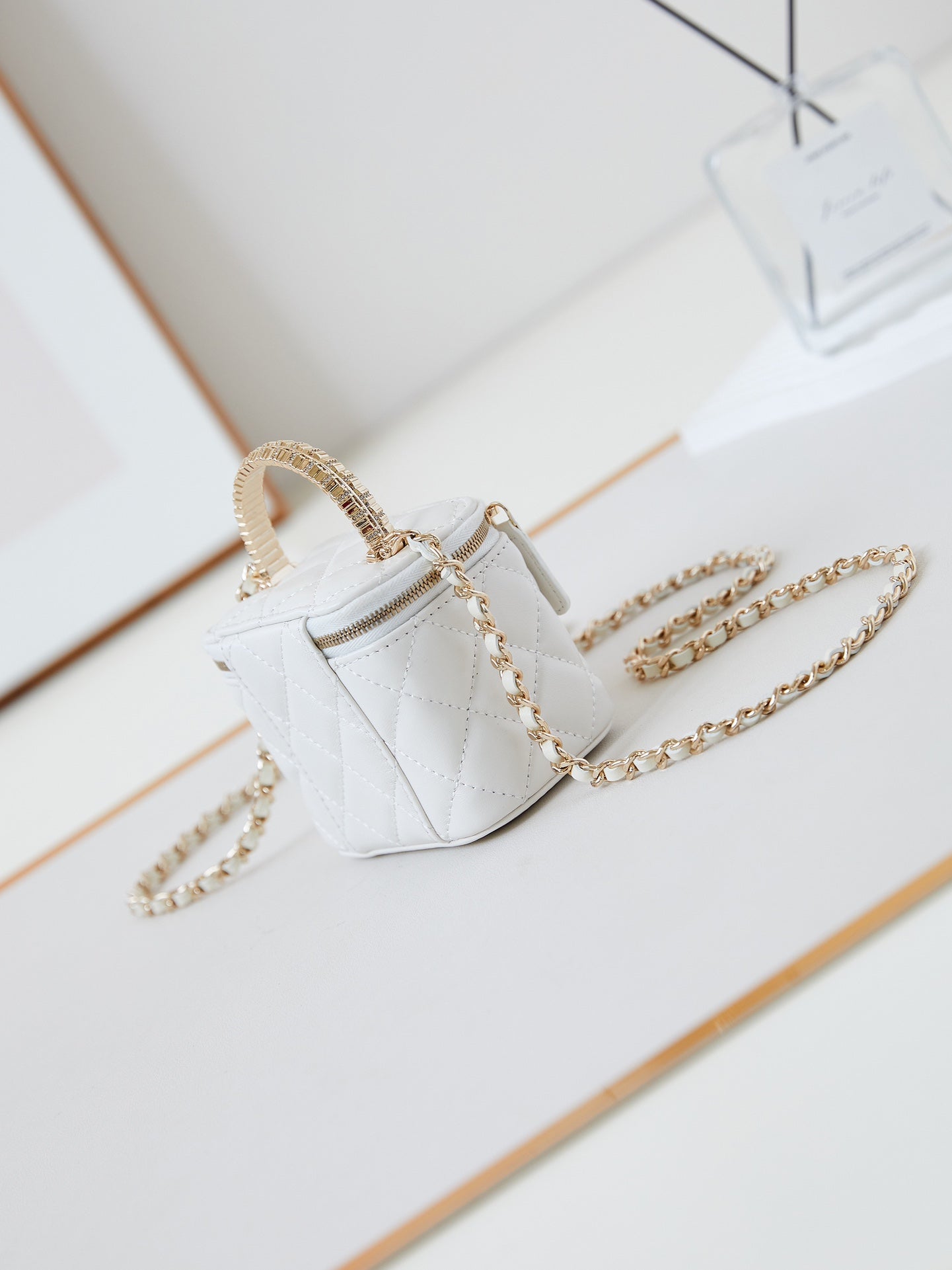 CHANEL 25S MINI VANITY BAG 11 CM IN WHITE LAMBSKIN WITH CRYSTAL-EMBELLISHED  LOGO