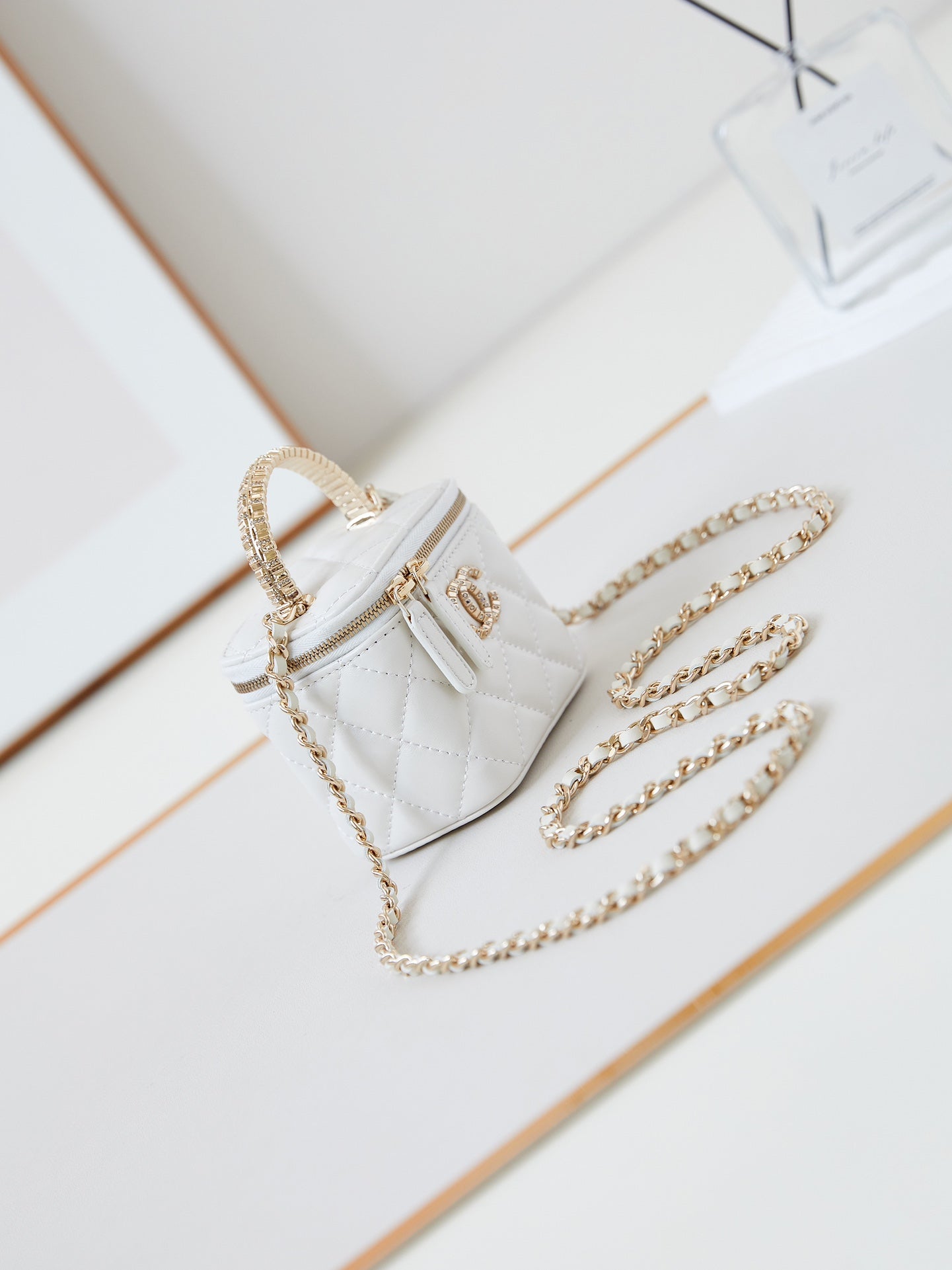 CHANEL 25S MINI VANITY BAG 11 CM IN WHITE LAMBSKIN WITH CRYSTAL-EMBELLISHED  LOGO