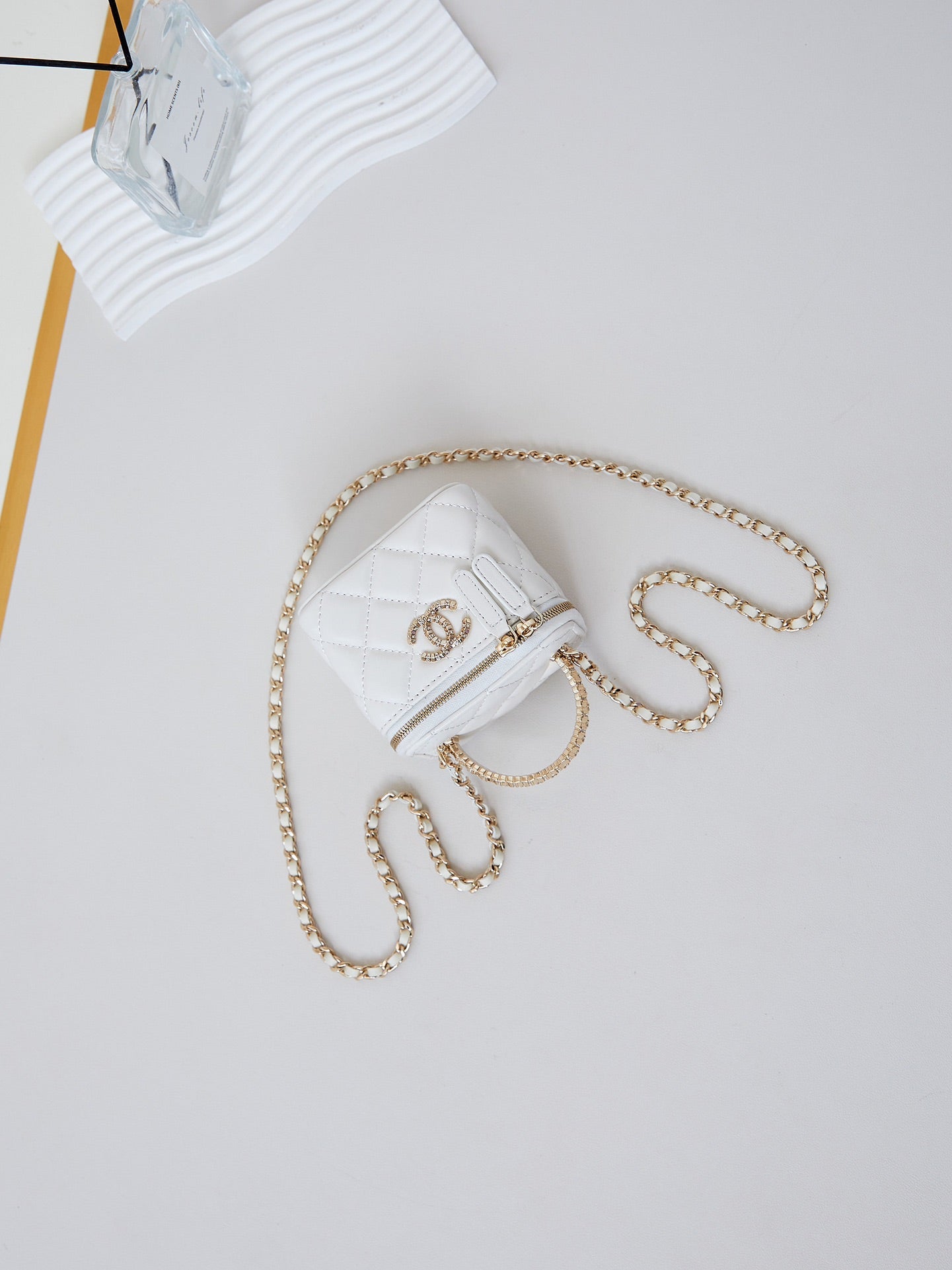CHANEL 25S MINI VANITY BAG 11 CM IN WHITE LAMBSKIN WITH CRYSTAL-EMBELLISHED  LOGO