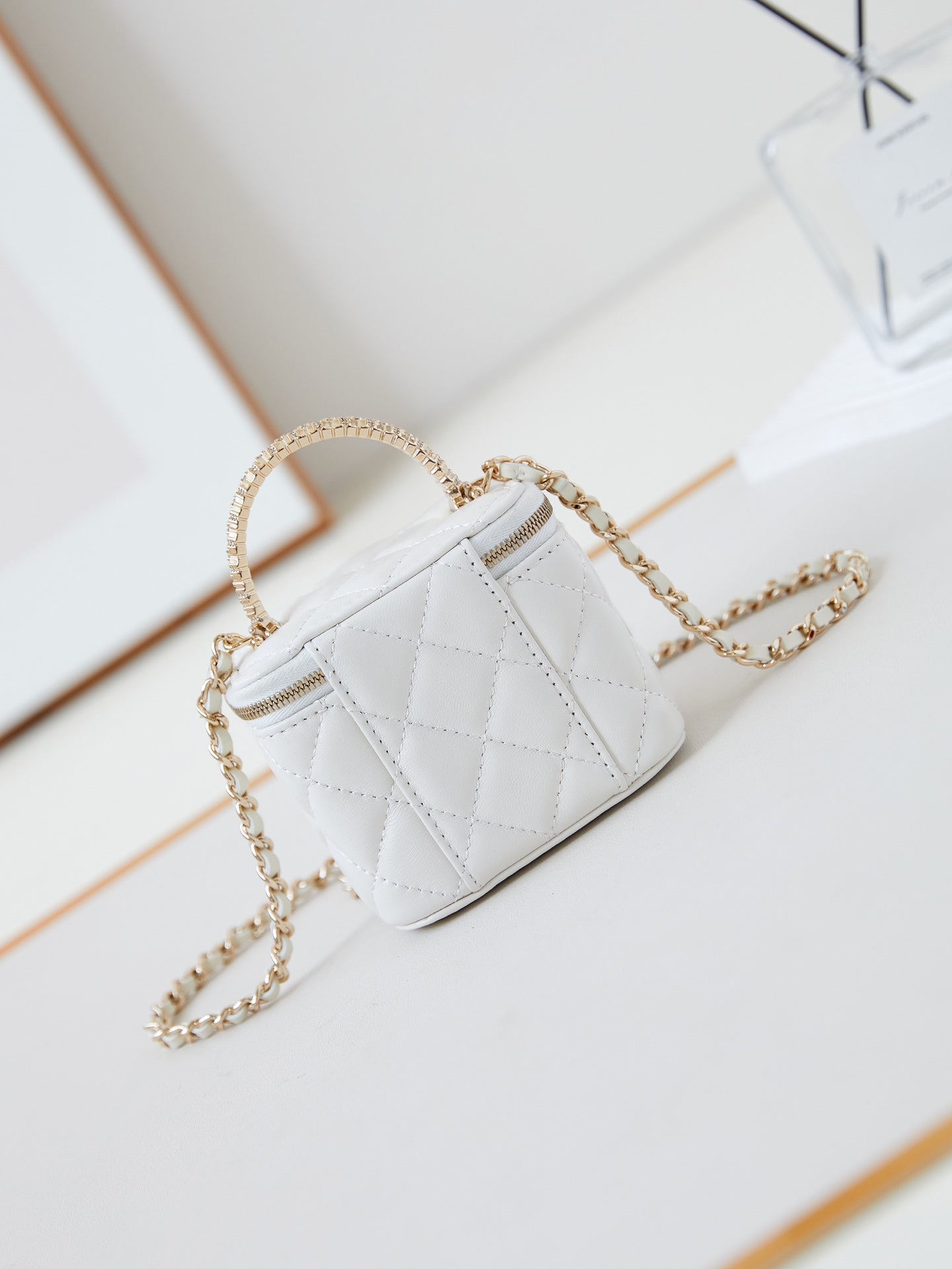 CHANEL 25S MINI VANITY BAG 11 CM IN WHITE LAMBSKIN WITH CRYSTAL-EMBELLISHED  LOGO