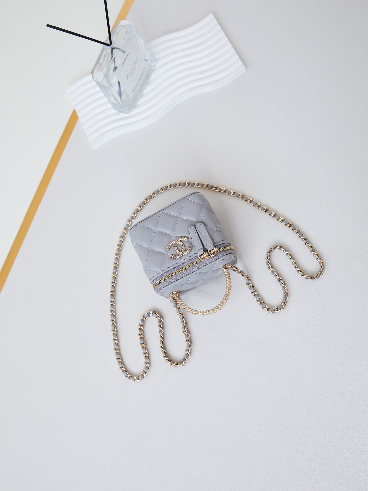CHANEL 25S MINI VANITY BAG 11 CM IN GREY LAMBSKIN WITH CRYSTAL-EMBELLISHED  LOGO