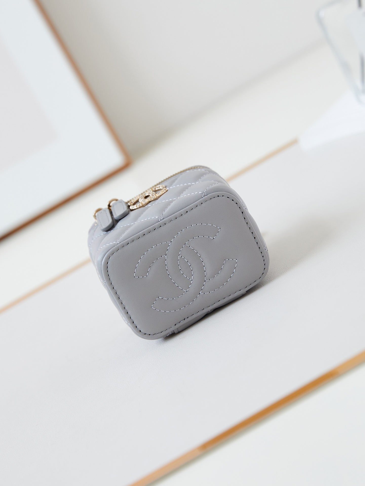 CHANEL 25S MINI VANITY BAG 11 CM IN GREY LAMBSKIN WITH CRYSTAL-EMBELLISHED  LOGO