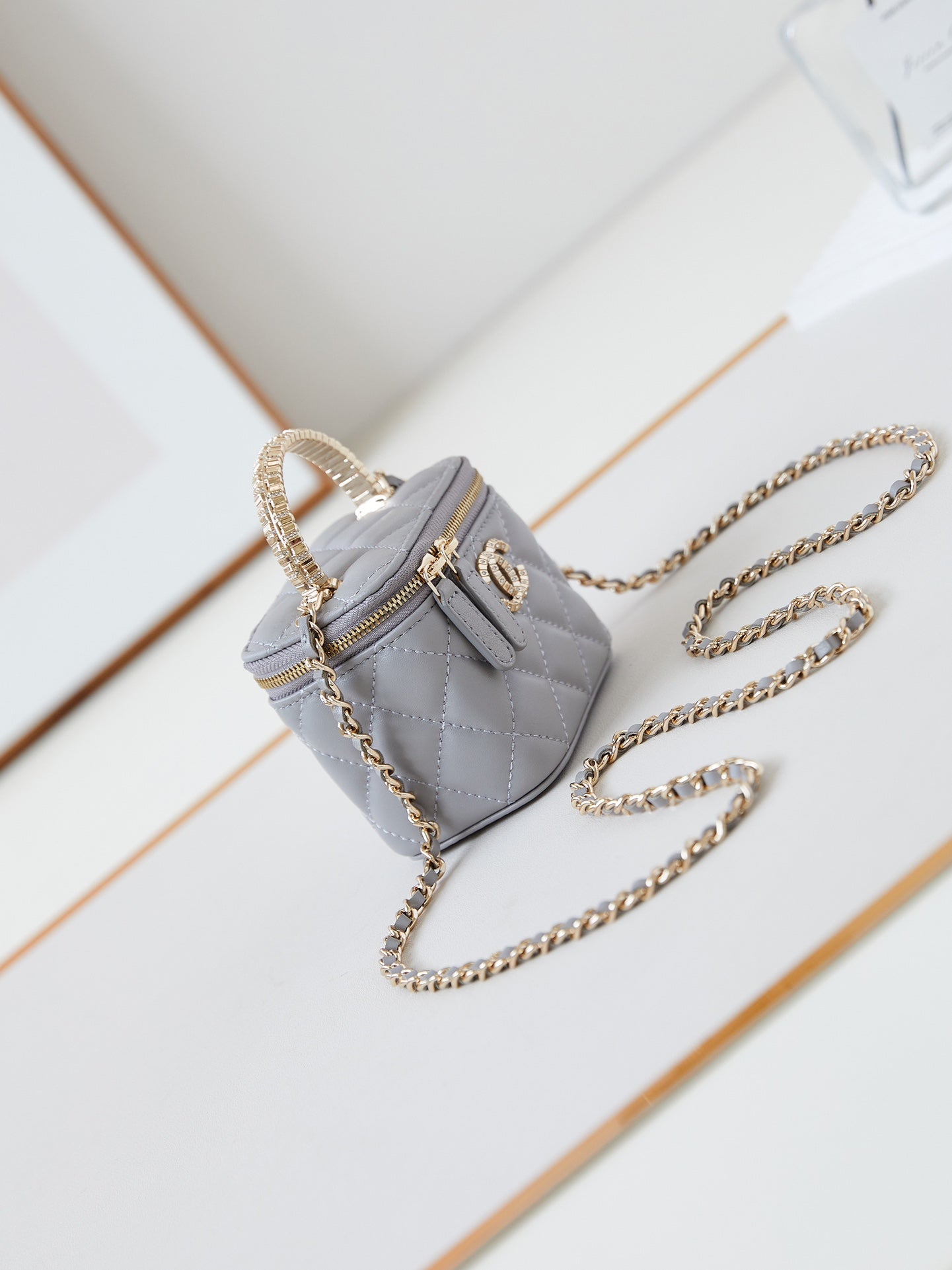 CHANEL 25S MINI VANITY BAG 11 CM IN GREY LAMBSKIN WITH CRYSTAL-EMBELLISHED  LOGO