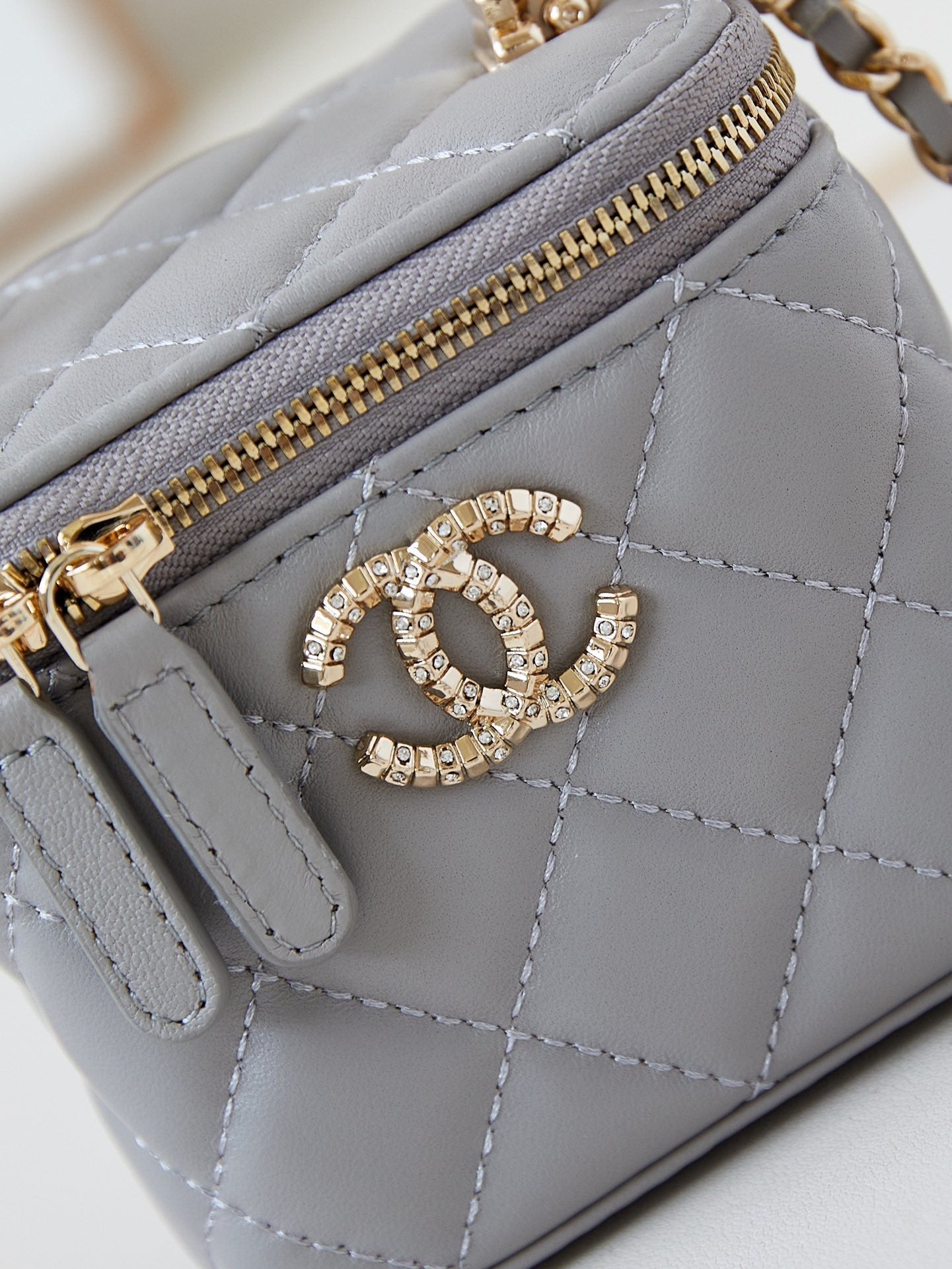 CHANEL 25S MINI VANITY BAG 11 CM IN GREY LAMBSKIN WITH CRYSTAL-EMBELLISHED  LOGO