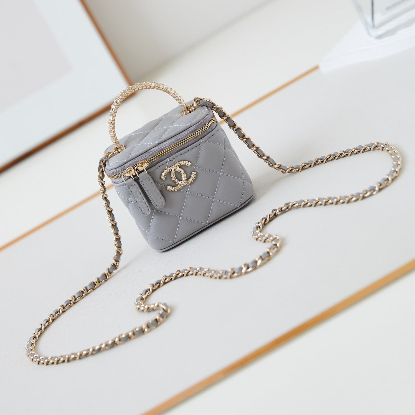 CHANEL 25S MINI VANITY BAG 11 CM IN GREY LAMBSKIN WITH CRYSTAL-EMBELLISHED  LOGO