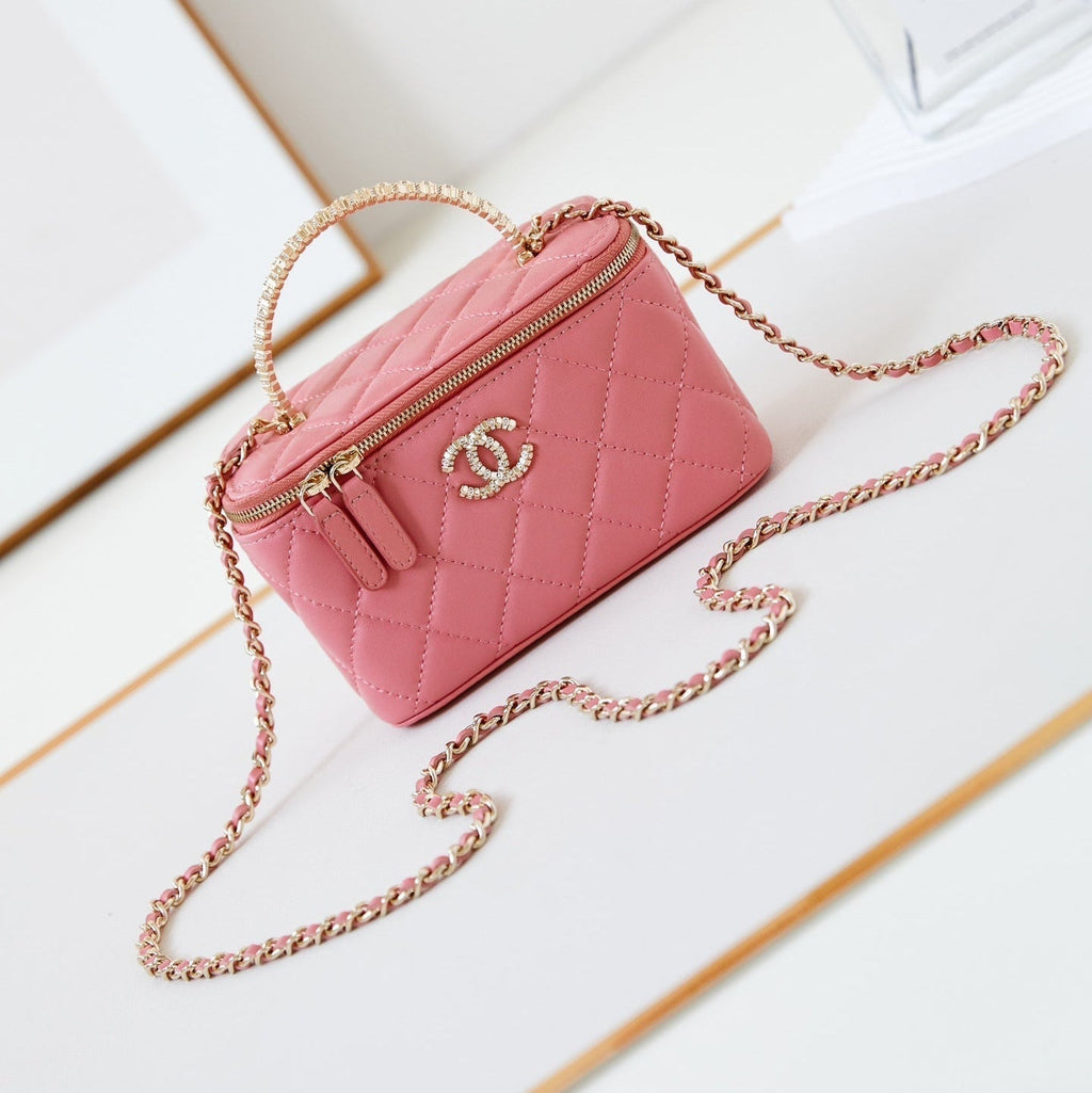 CHANEL 25S MINI VANITY BAG 16 CM IN PEACHY PINK LAMBSKIN WITH CRYSTAL-EMBELLISHED  LOGO