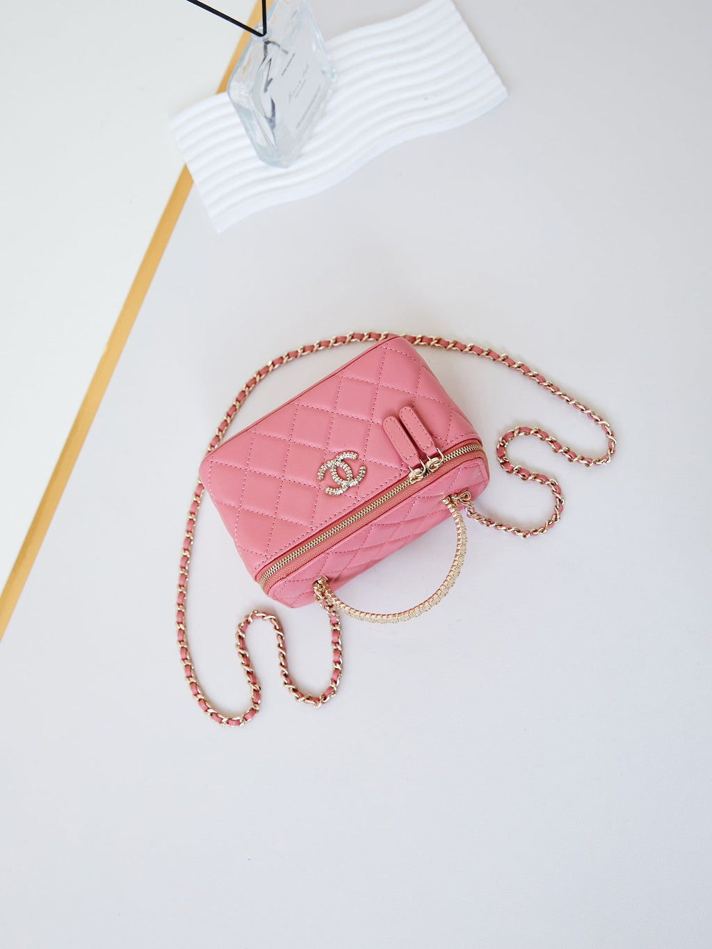 CHANEL 25S MINI VANITY BAG 16 CM IN PEACHY PINK LAMBSKIN WITH CRYSTAL-EMBELLISHED  LOGO