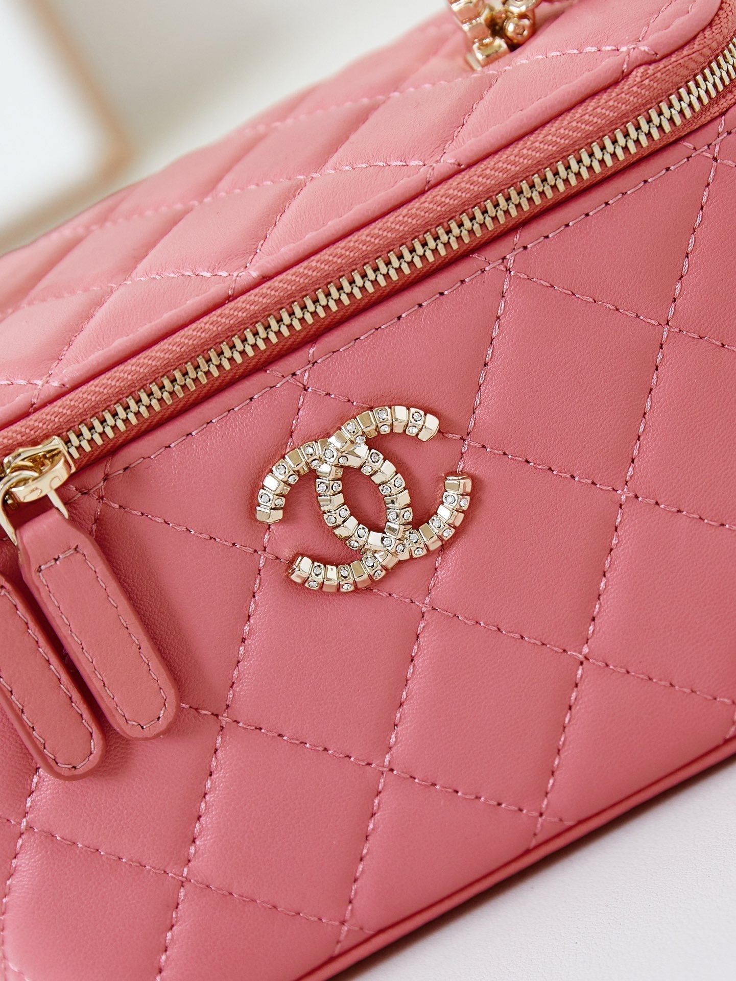 CHANEL 25S MINI VANITY BAG 16 CM IN PEACHY PINK LAMBSKIN WITH CRYSTAL-EMBELLISHED  LOGO