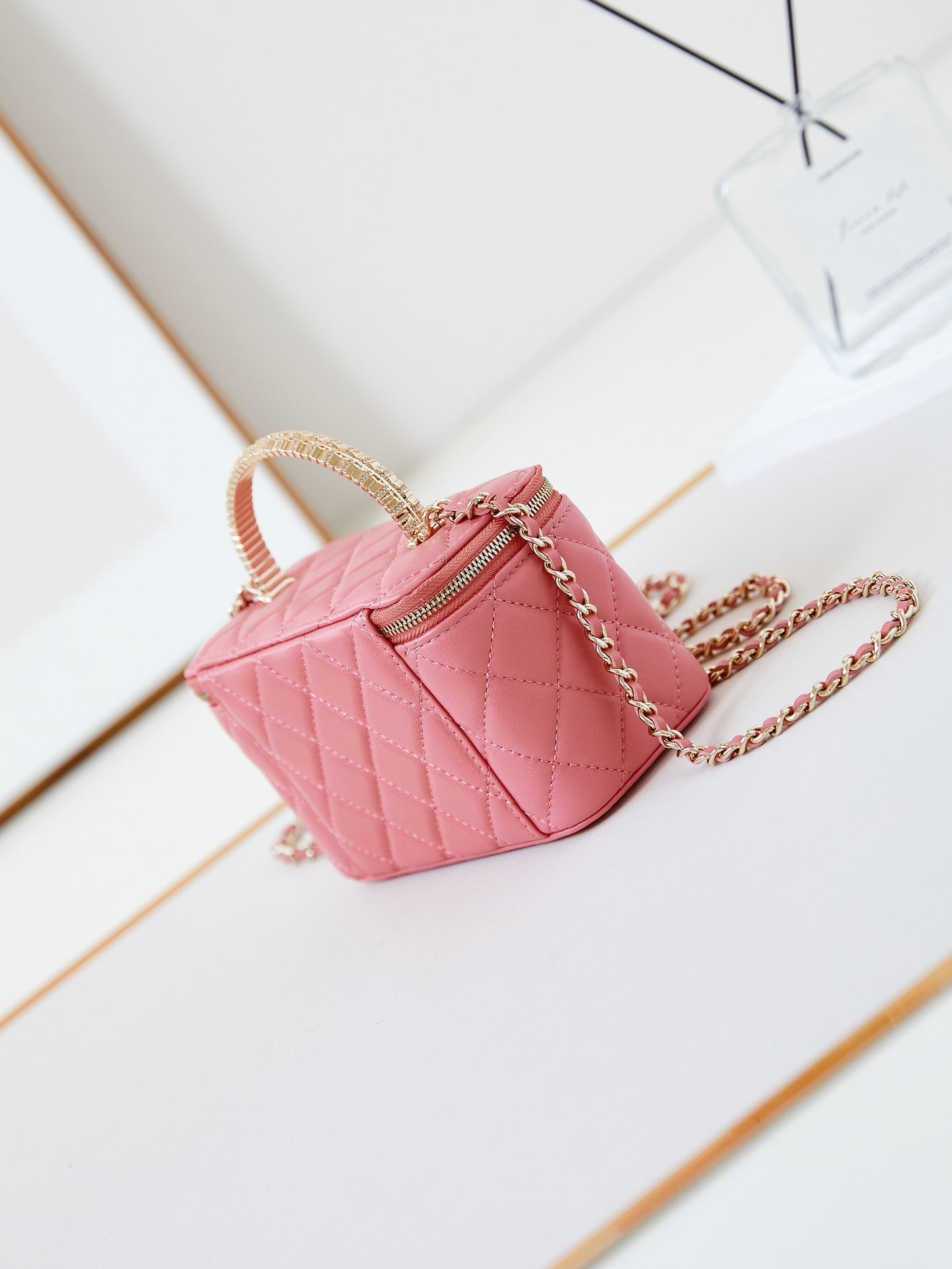 CHANEL 25S MINI VANITY BAG 16 CM IN PEACHY PINK LAMBSKIN WITH CRYSTAL-EMBELLISHED  LOGO