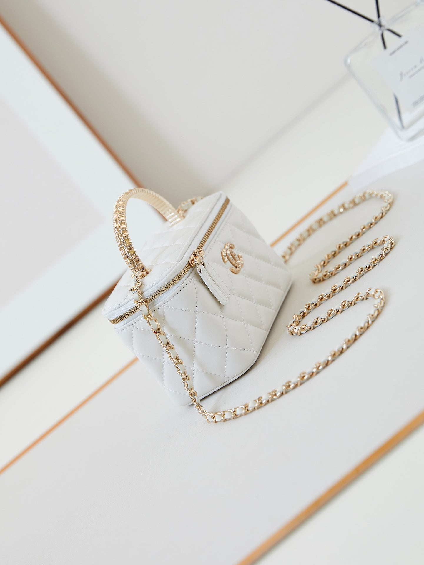 CHANEL 25S MINI VANITY BAG 16 CM IN WHITE LAMBSKIN WITH CRYSTAL-EMBELLISHED  LOGO