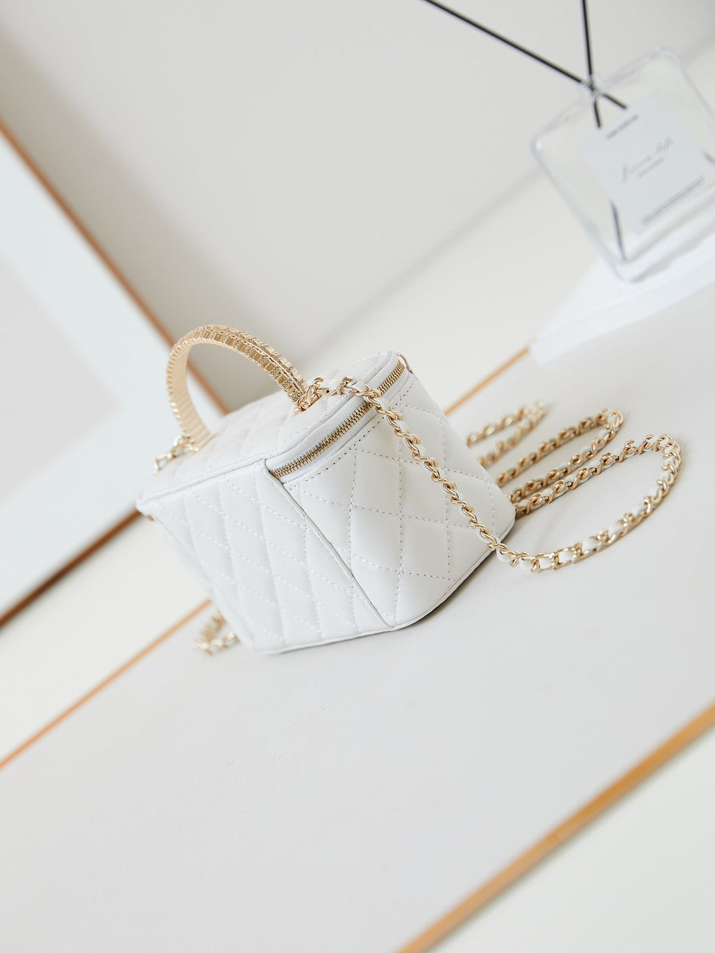 CHANEL 25S MINI VANITY BAG 16 CM IN WHITE LAMBSKIN WITH CRYSTAL-EMBELLISHED  LOGO