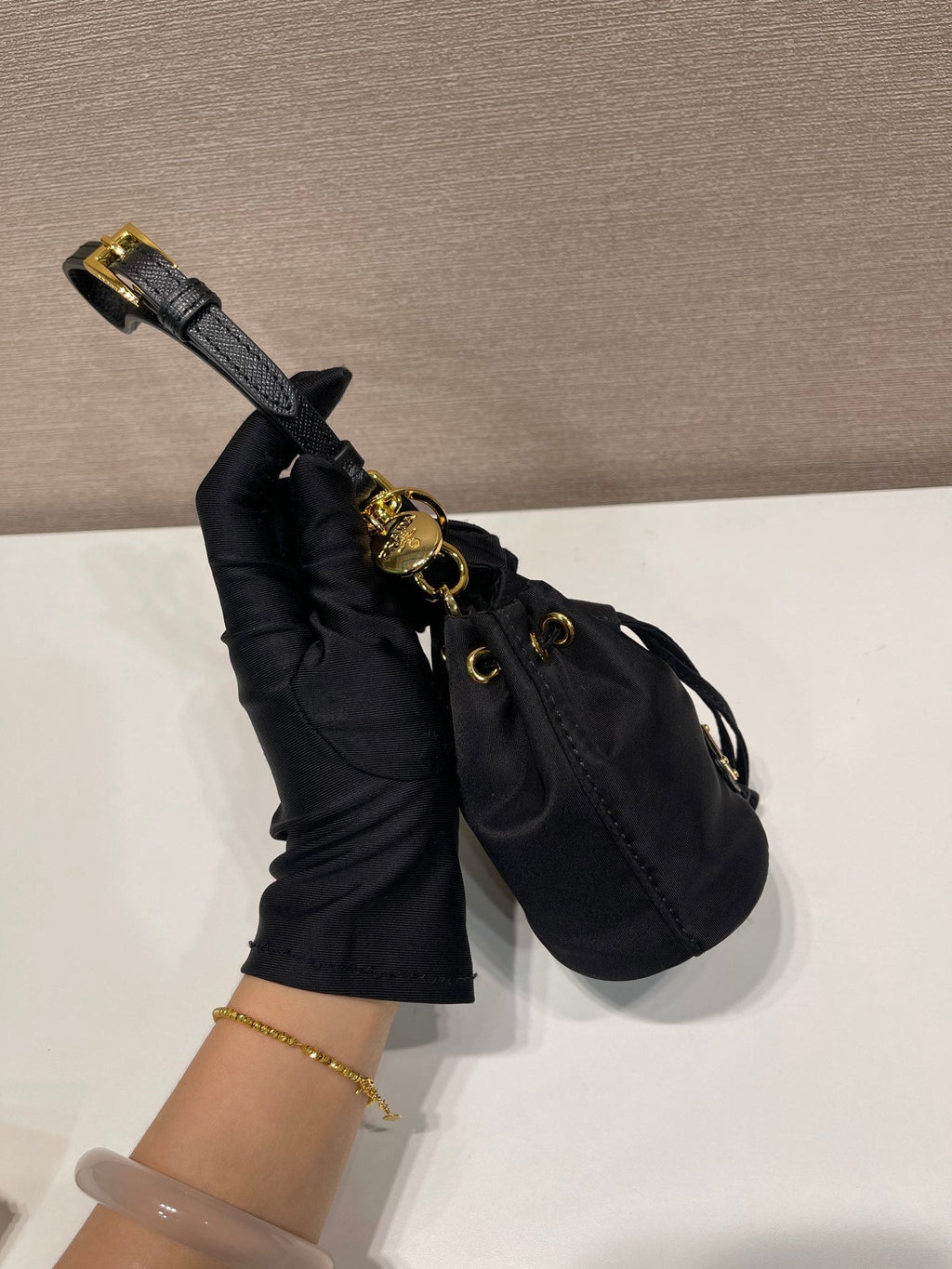 PRADA MINI BUCKET BAG 10 IN BLACK RE-NYLON AND SAFFIANO LEATHER STRAP