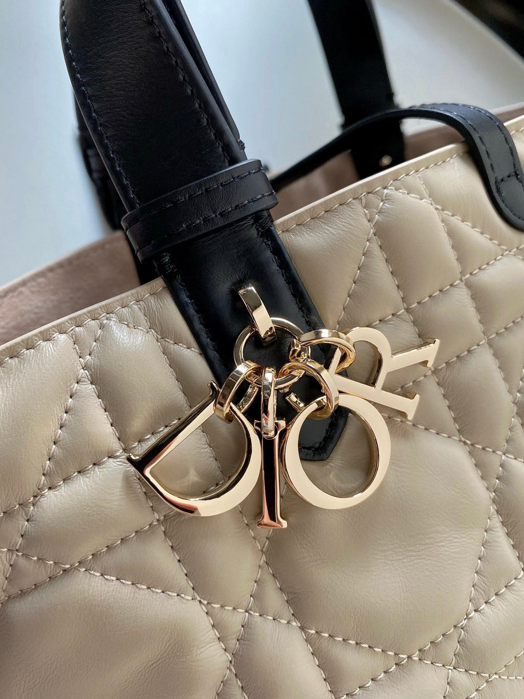 DIOR MINI TOUJOURS BAG 23 IN BEIGE CANNAGE CALFSKIN BLACK STRAP