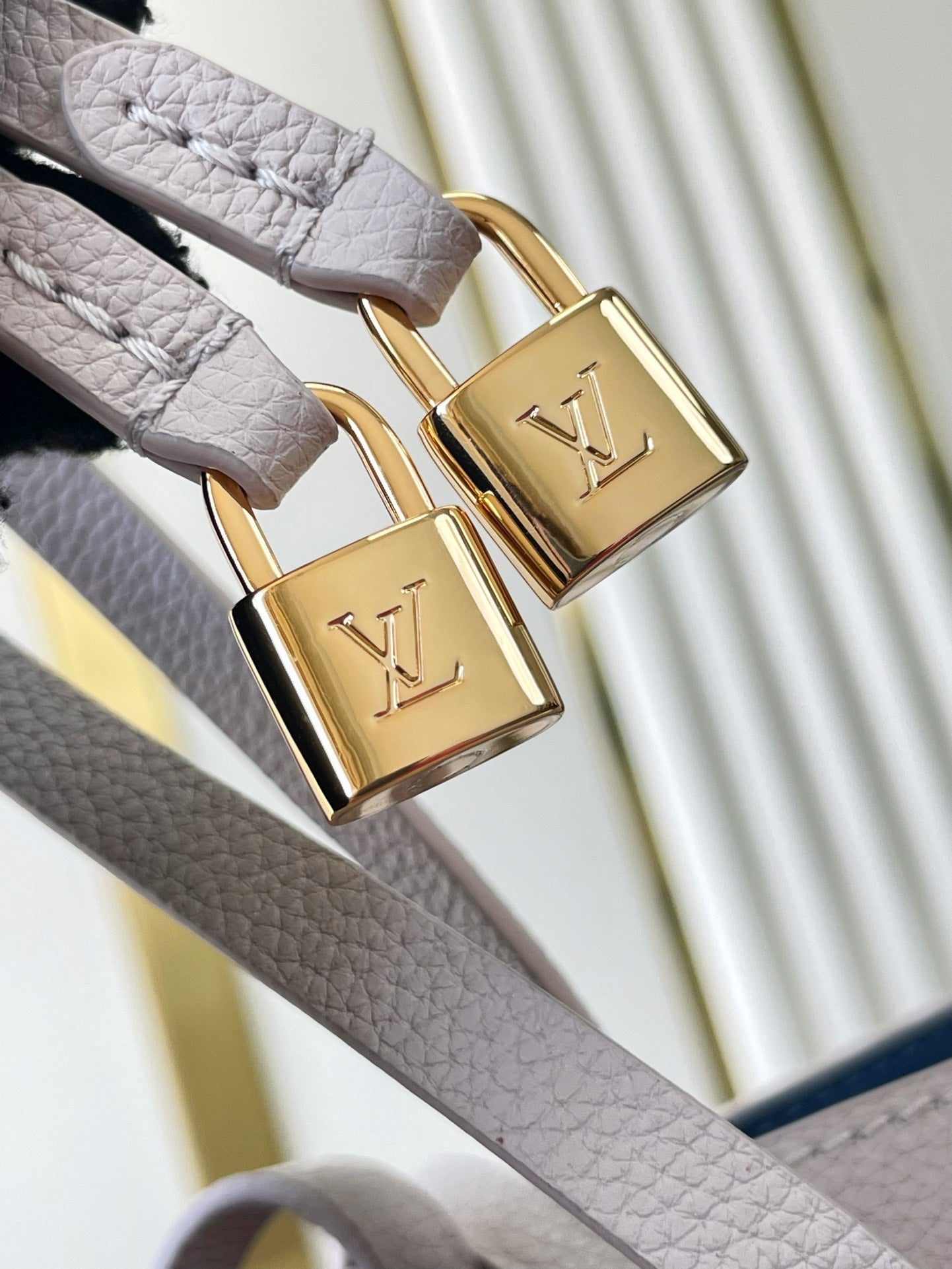 LOUIS VUITTON FLORE 28 IN WHITE PERFORATED CALFSKIN