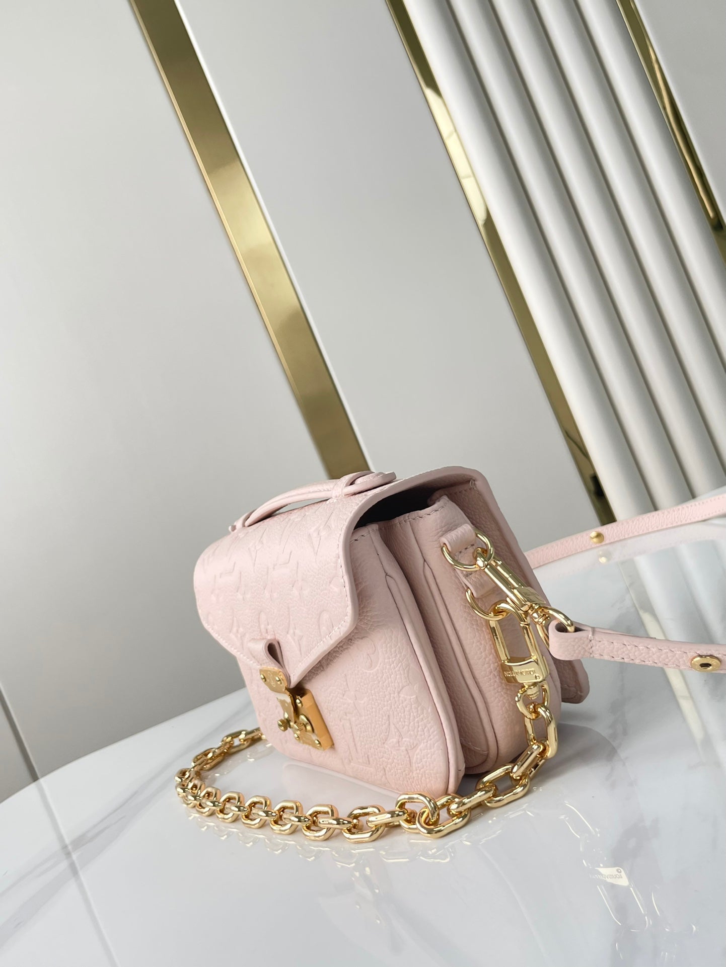 LOUIS VUITTON POCHETTE MÉTIS EAST WEST 21 IN PINK OPALE MONOGRAM ECLIPSE CANVAS GOLD BUCKLE