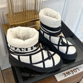 CHANEL SKI BOOTS IN WHITE MIX BLACK QUILTED COTTON