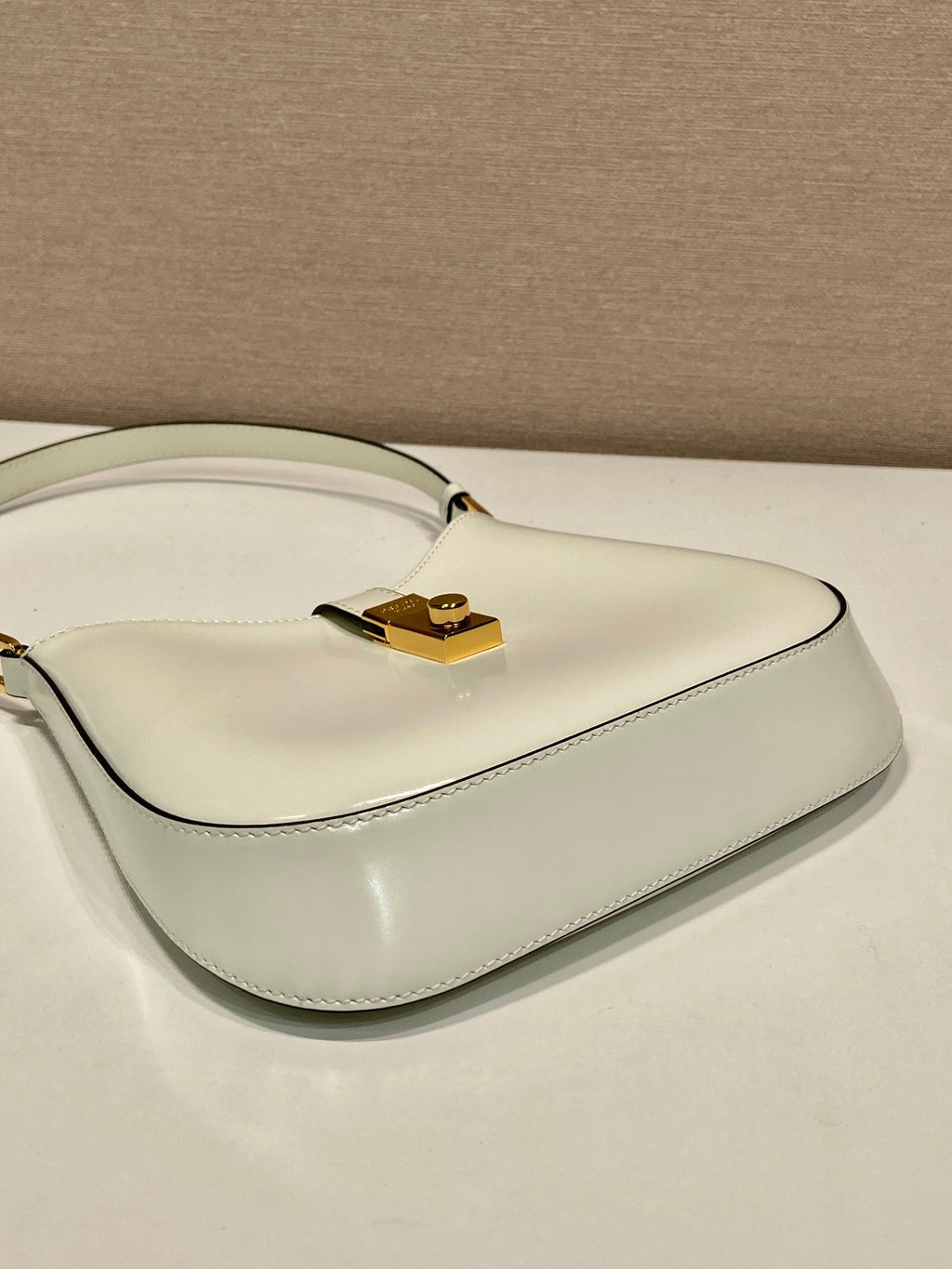 PRADA CLEO SHOULDER BAG 22 IN WHITE BRUSHED LAMBSKIN WITH CLASP CLOSURE