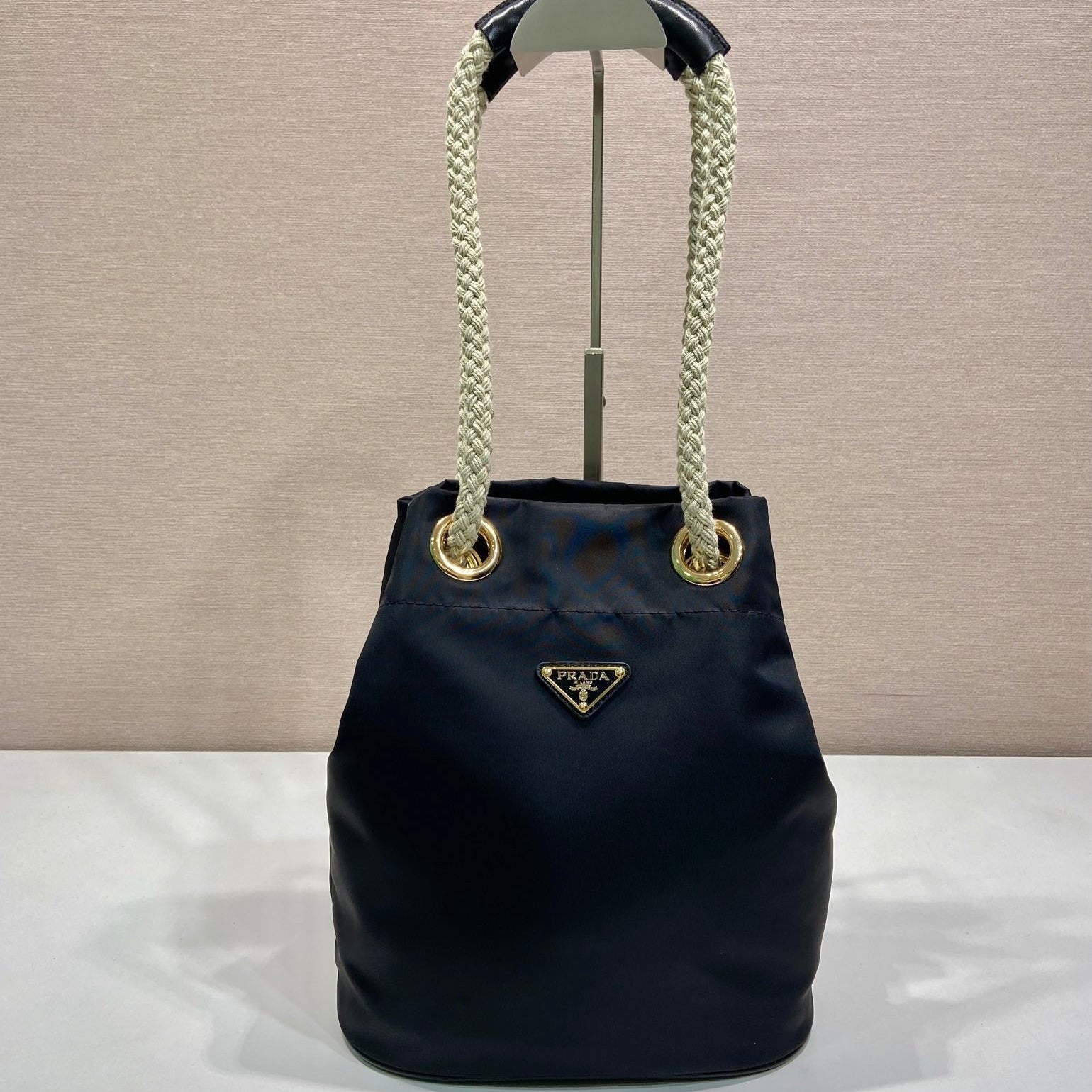 PRADA BUCKET BAG 28 IN BLACK RE-NYLON GOLD LOGO